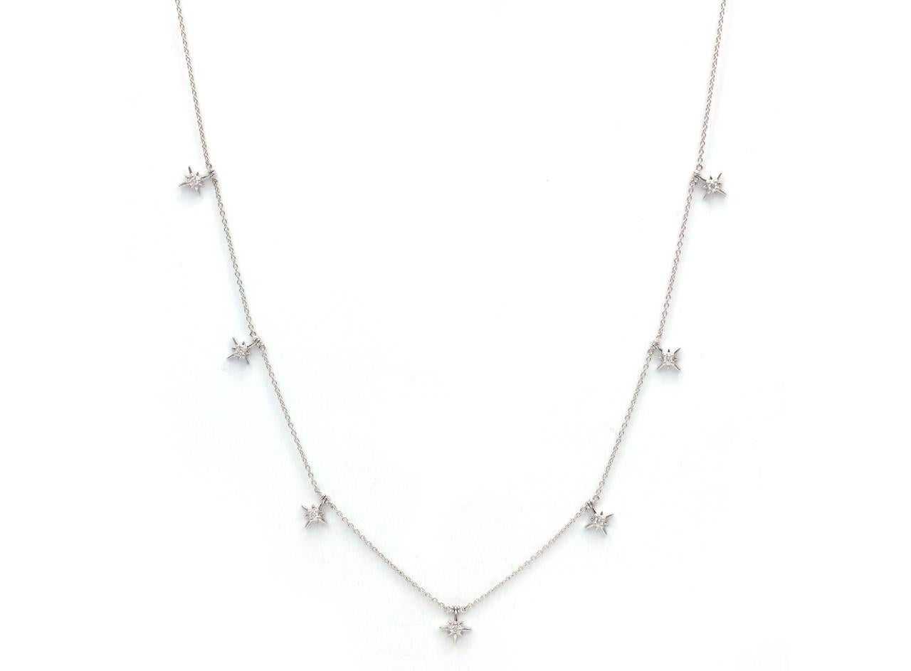Glamorous 18 K white gold diamond chain necklace featuring 7 star with diamonds in the middle. Stars have been symbolic of divine guidance and protection. This elegant adjustable chain necklace is a stunning  piece of jewellery which is suitable for