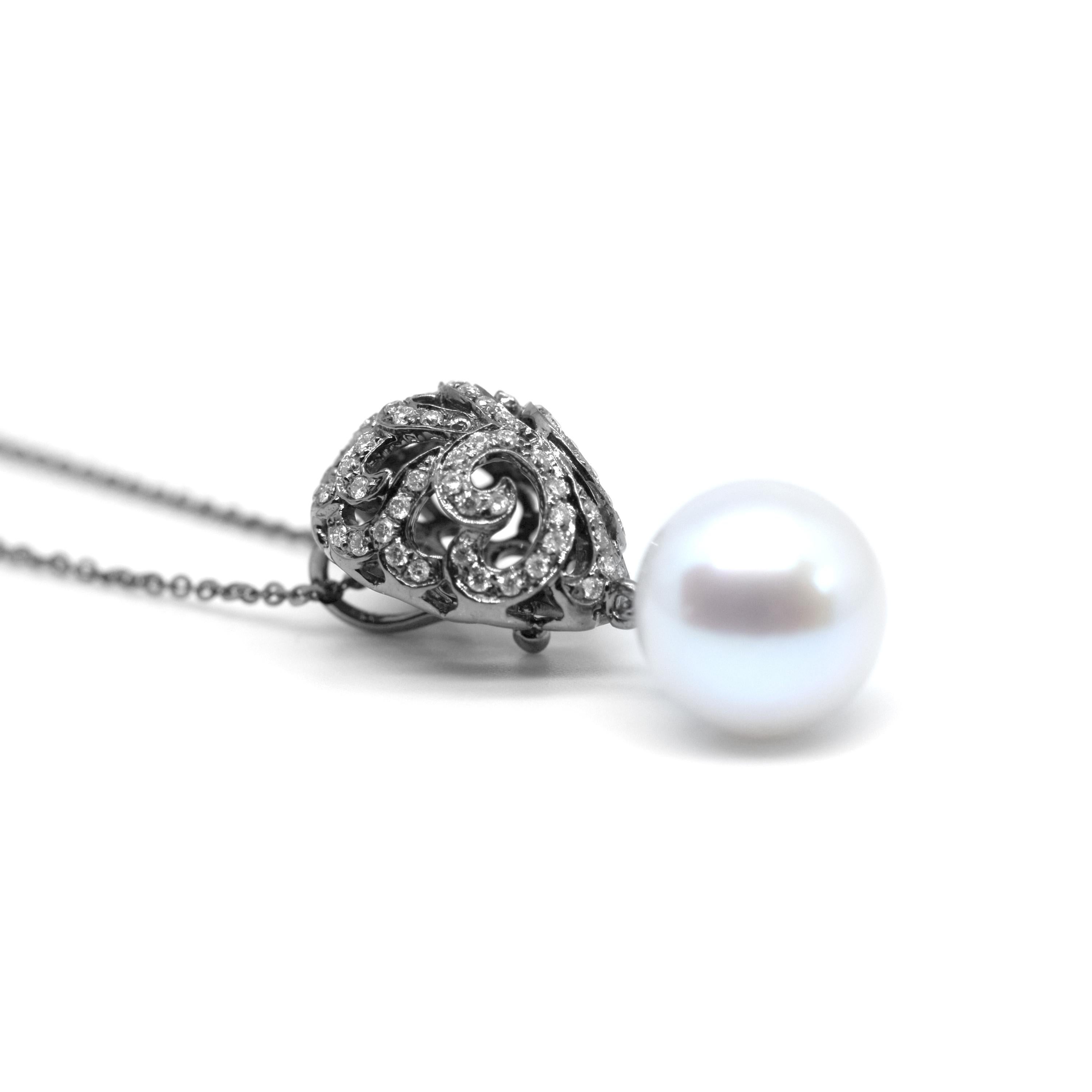 Emulating femininity and glamour, the Whispering collection is full of colour and form. Inspired by the twisting, sculptural shape of the exotic Orchid flower. Whispering pearl drop small domed filigree egg pendant with 0.22ct white diamonds and 9mm