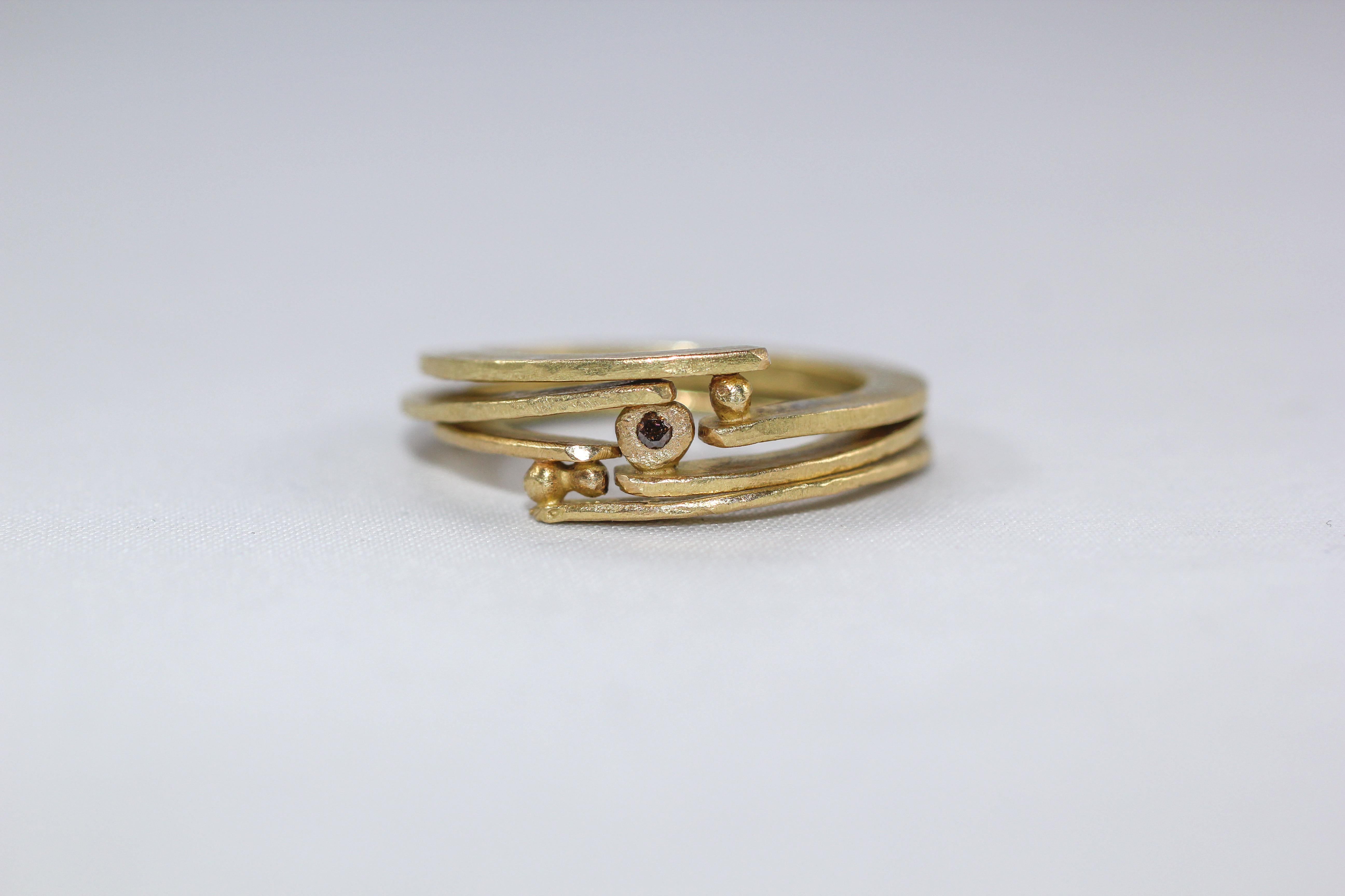 Bridal wedding band ring. Brown diamond set in 18K Gold. Simplicity With A Twist ring design. 
Pictured for sale a stack of three rings: Holding One granule, Two granules, Holding a diamond.

These striking bridal wedding band rings are first