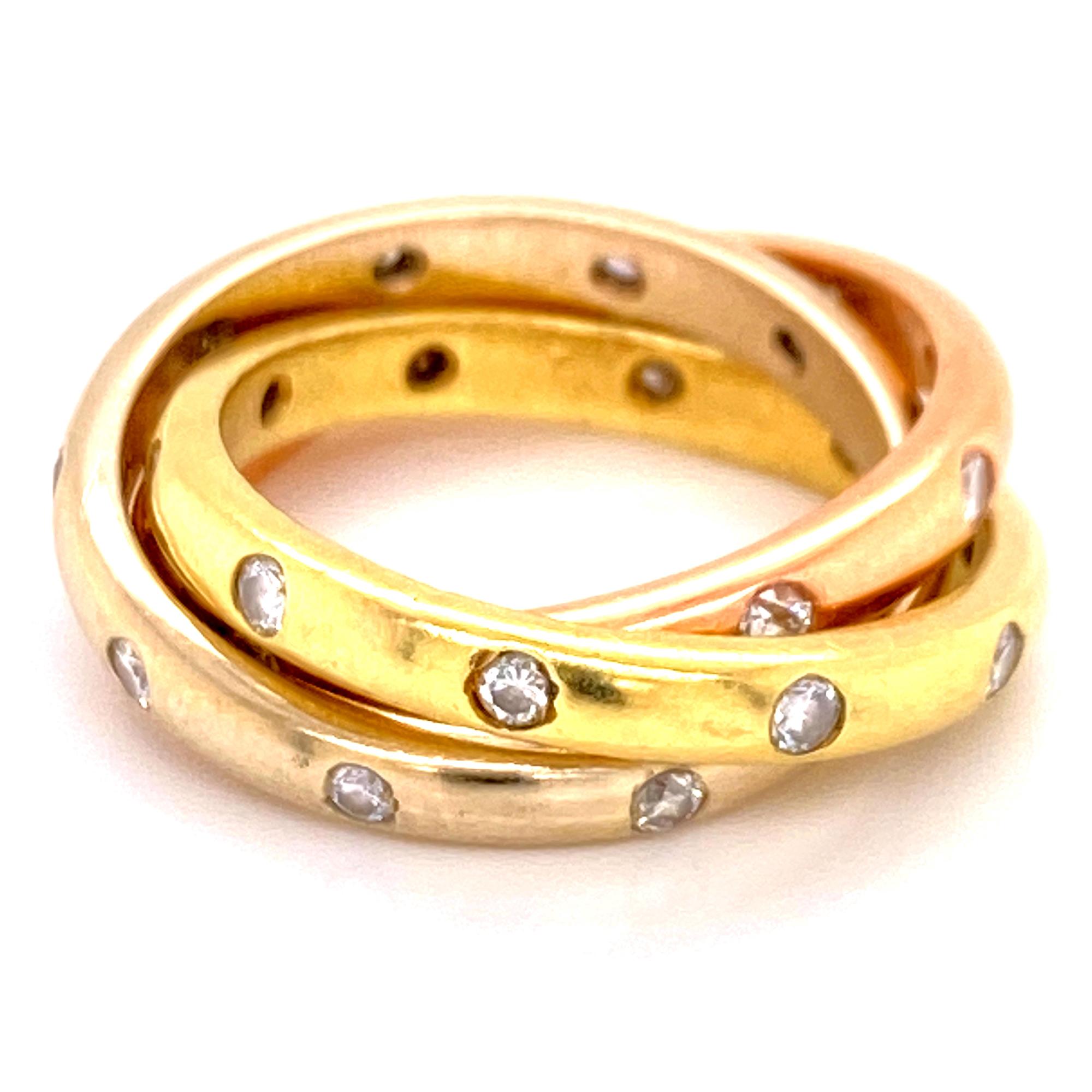 Diamond rolling ring fashioned in 18 karat tricolor gold. The three intertwined bands feature round brilliant cut diamonds weighing .60 carat total weight. Each band measures 3mm in width, and is size 5.5. 