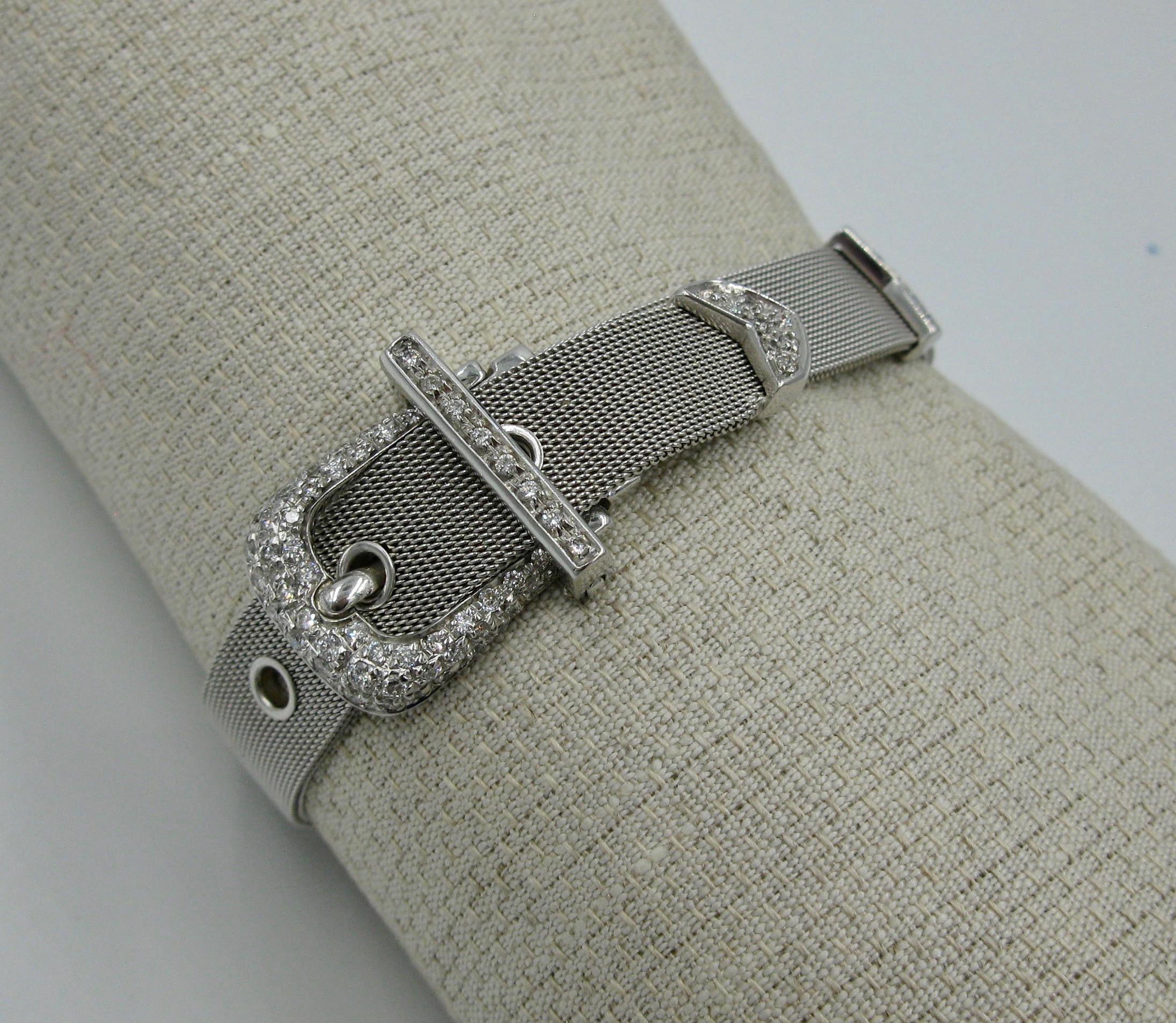 A magnificent Diamond Buckle Bracelet with classic style.   The sensuous bracelet is in 18 Karat White Gold mesh - scrumptious!  The bracelet is set with brilliant white diamonds which total 1 Carat and are H color (very white).  In addition to the