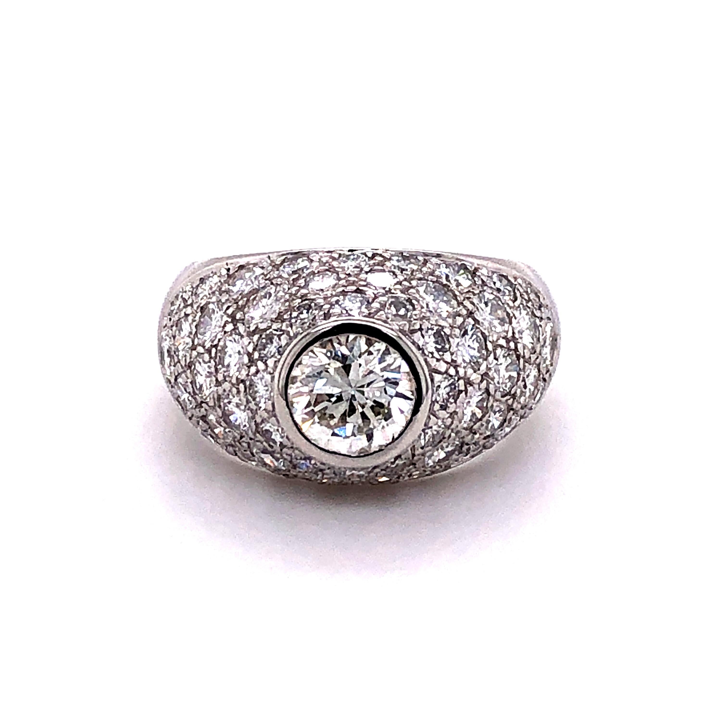 On top of this dome shaped 18 karat white gold ring sits a sparkling 0.92 carats brilliant cut diamond of H color and vs2 clarity. Beautifully pave set mounting with 54 brilliant cut diamonds of G/H color and vs clarity, total weight 2.20 carats.
