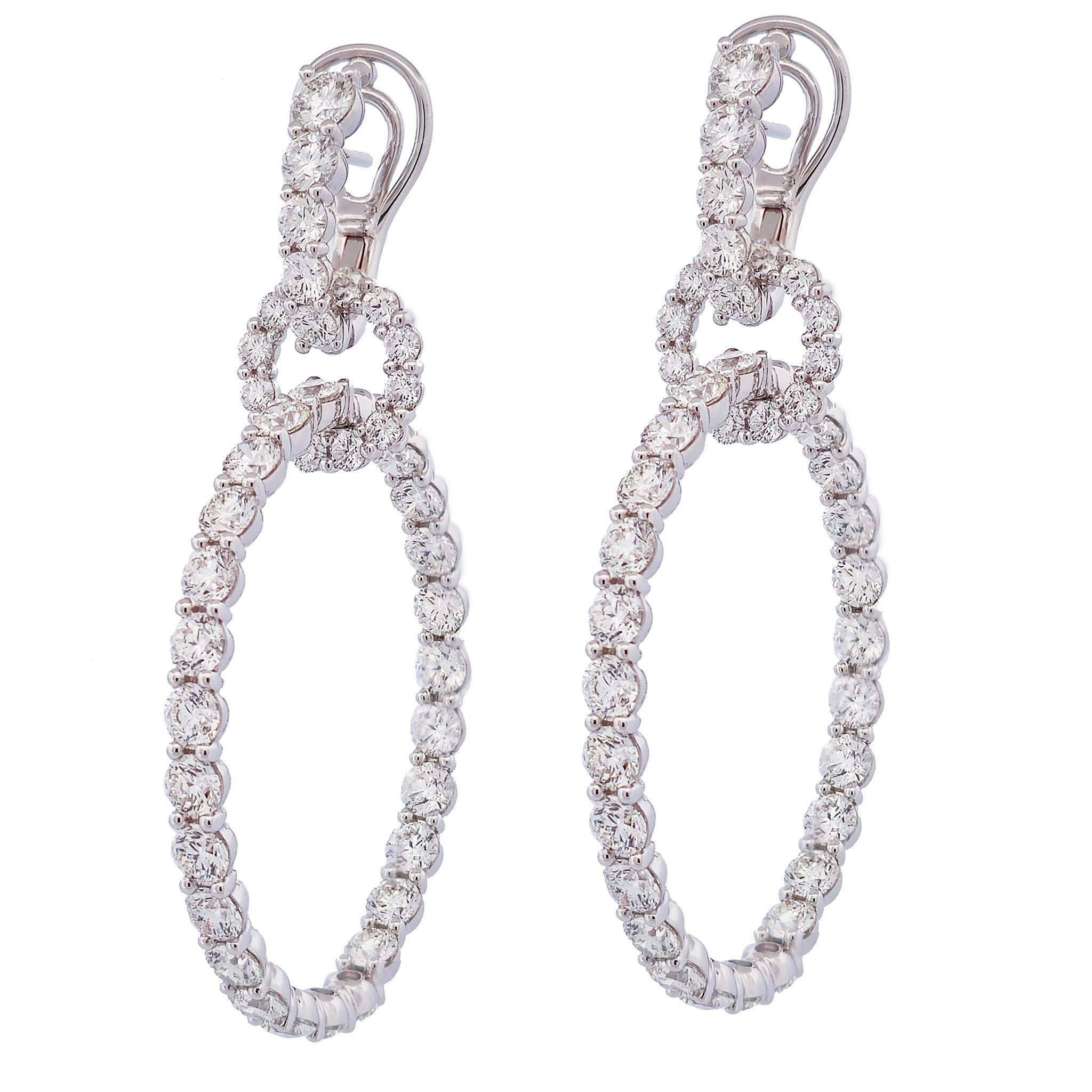 Glimmering 18 karat white gold earrings feature 13.46 carats of unforgettable F-VS diamonds, draping your lobes in incomparable luxury and sparkle!

These show stopping earring measure 60 mm in length.
The top circle measures 15 mm across.
The