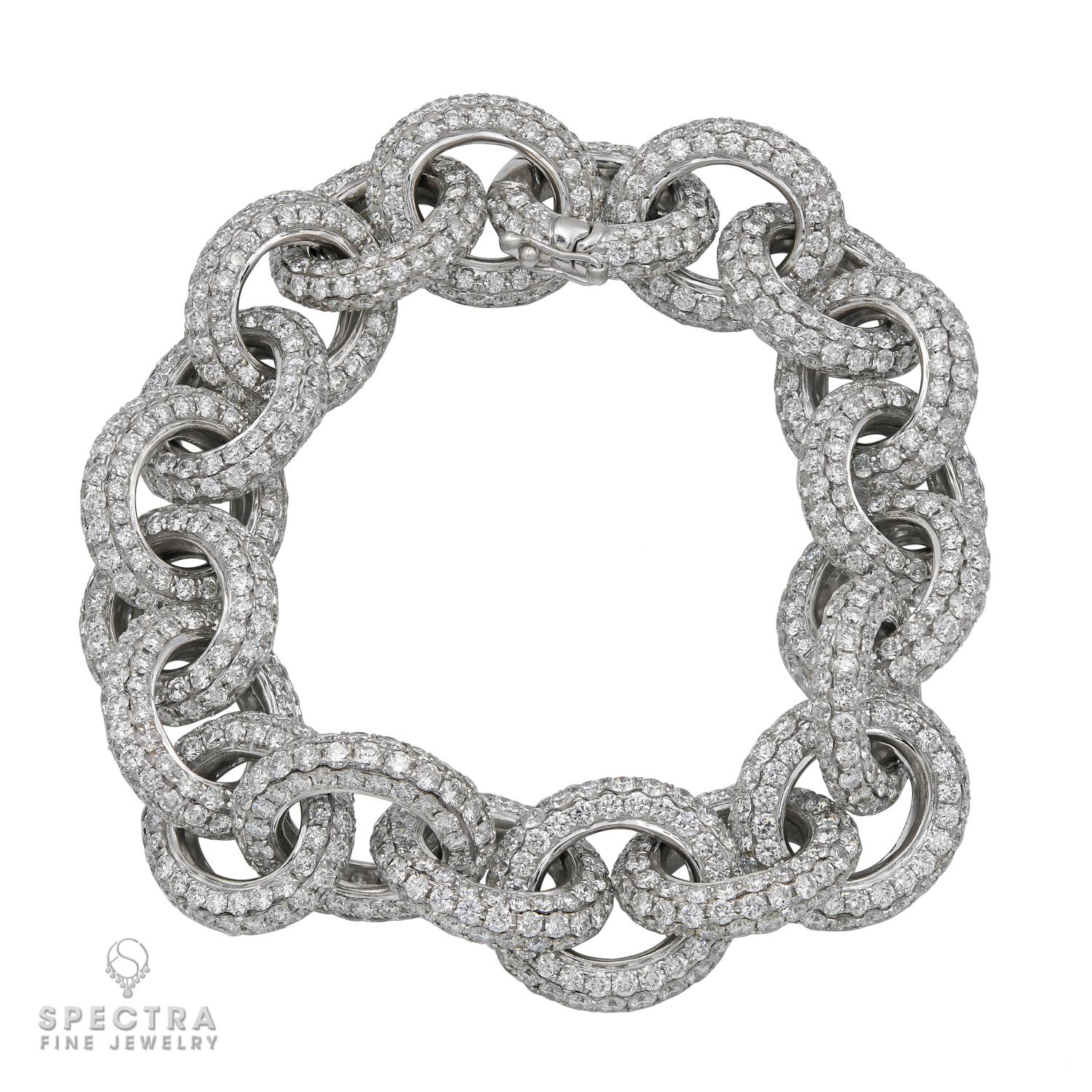 Crafted in 18K white gold in 2018, this Contemporary Diamond Pave Chain Link Bracelet is a celebration of sophistication. Weighing 44.52 grams, it features 20 playful oval links, each intricately paved with round brilliant-cut diamonds totaling