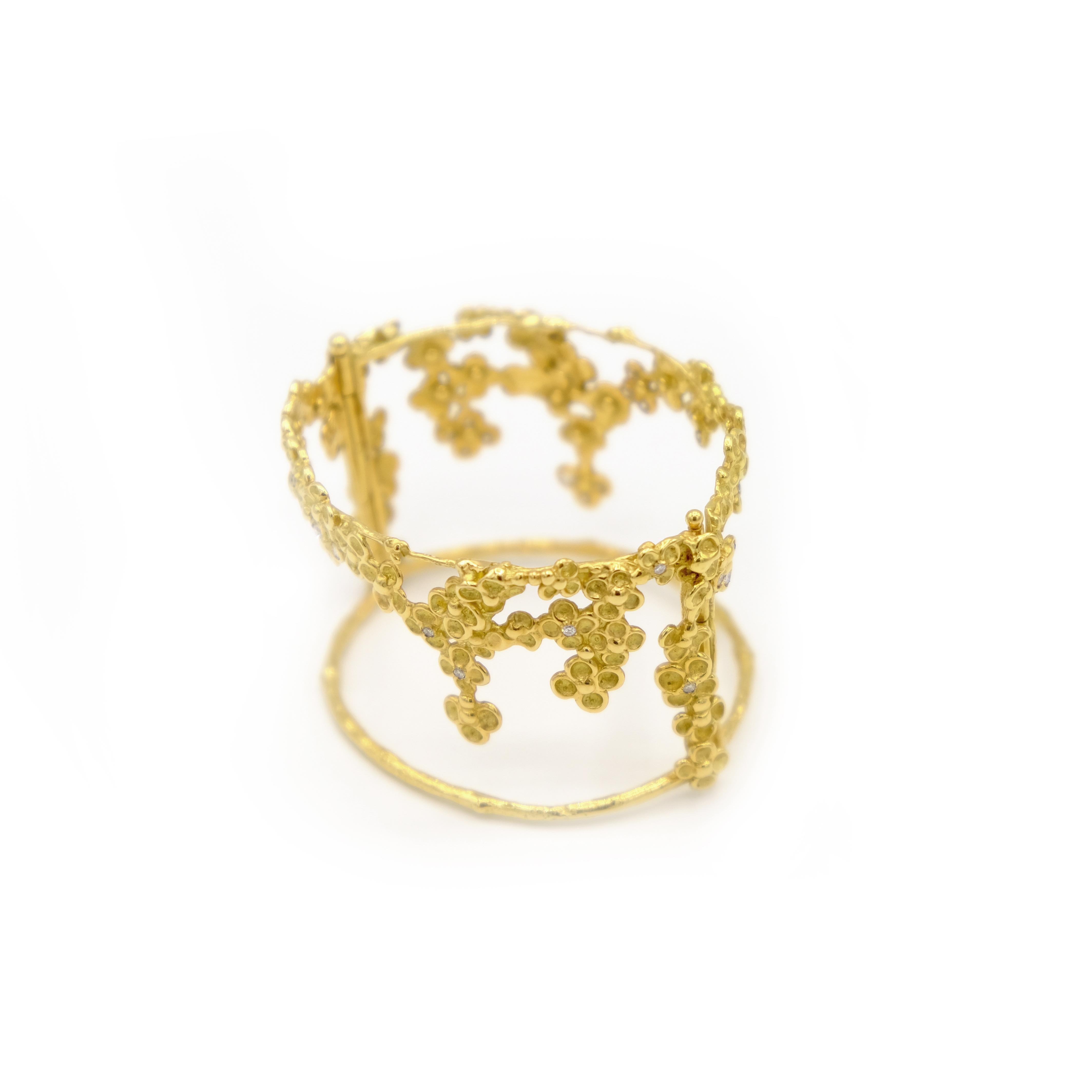 This Award-winning creation is a one-of-a-kind bracelet expertly crafted by hand from 18 Karat yellow gold approximately 48 grams. It is set with diamonds in total app 1.47 carats. Its width is app 5 cm and inside diameter is app. 5.9 cm. It is