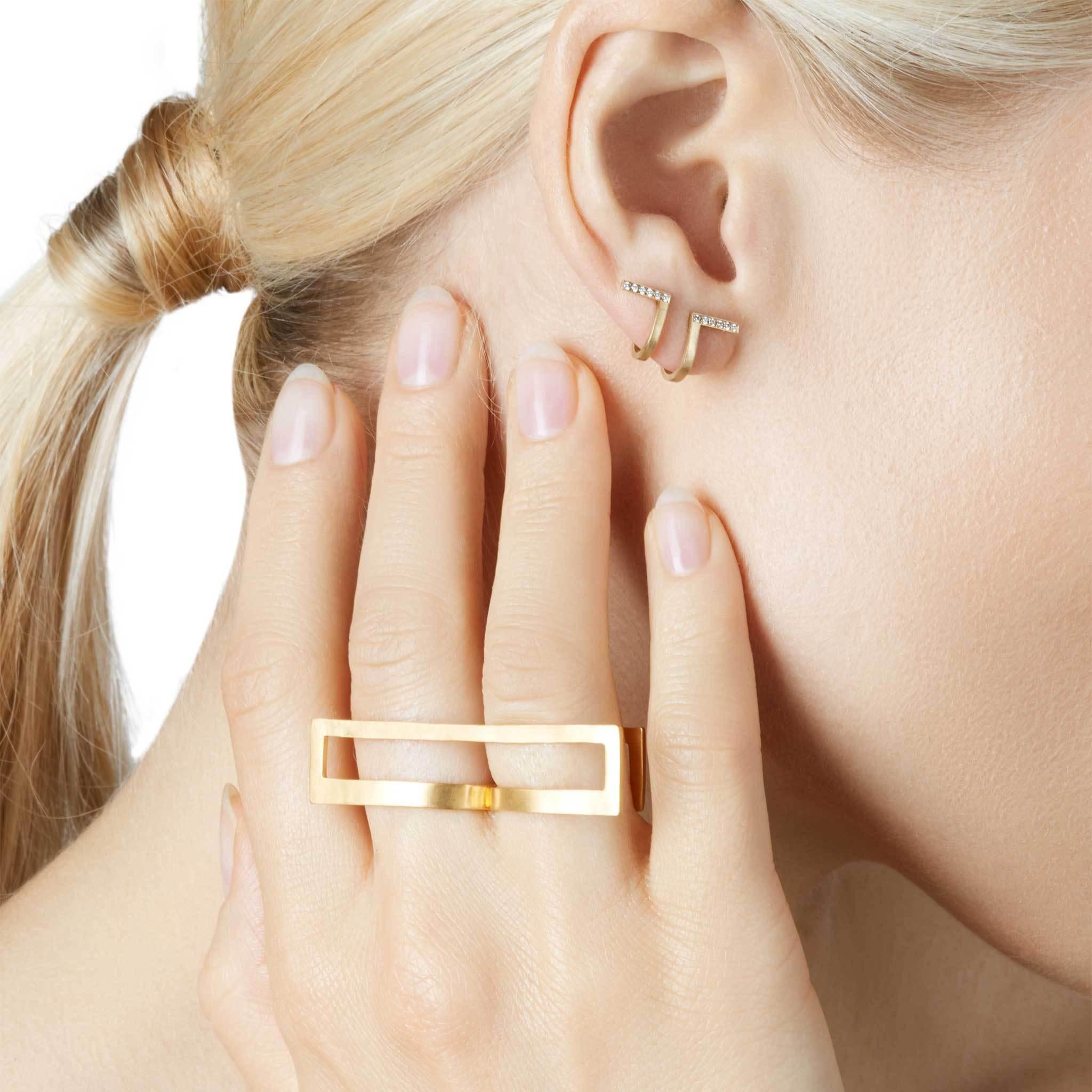 Unfinishing Line collection exudes minimalism and precision with its smooth lines and angles. Detailed with a curved structure and matt brushed finish. 18-Karat Yellow Gold Diamond Curve Earrings is perfect for day to night wear due to the