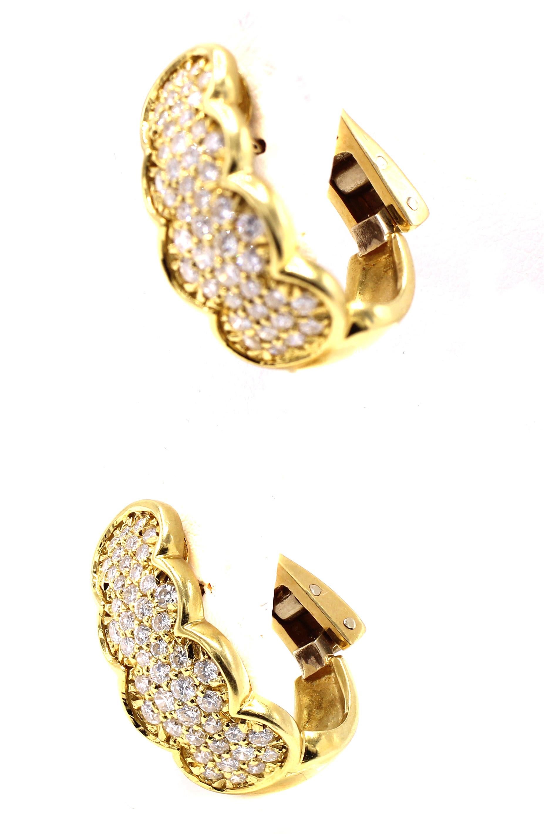 Beautifully designed and masterfully handcrafted these most wearable 18 karat yellow gold and diamond hoop earrings sparkle on the ear. Pave set with 92 bright white and lively round brilliant cut diamonds with an approximate total diamond weight of