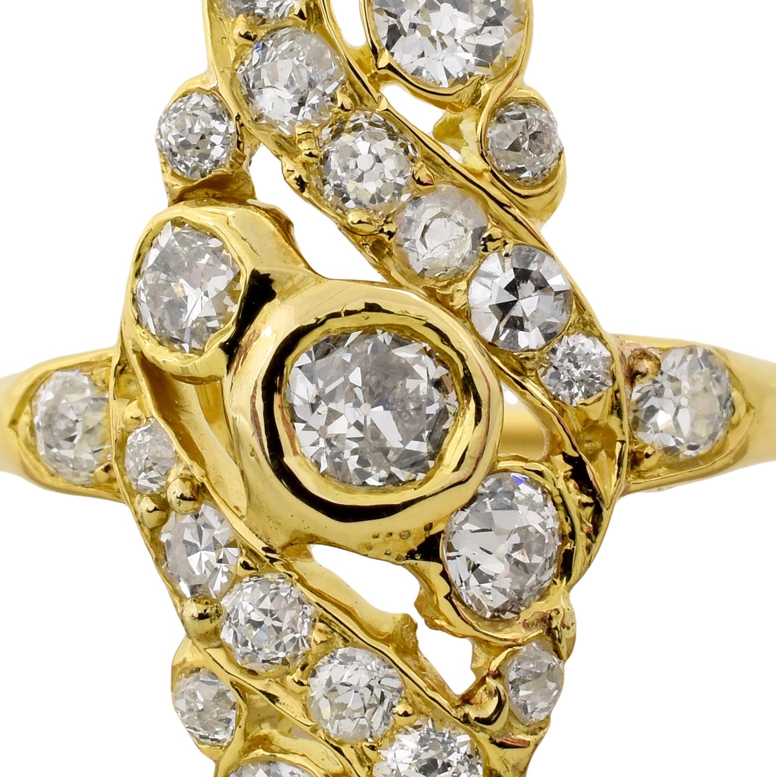 A navette shaped ring in 18k yellow gold that features 1.50cts of old cut diamonds.