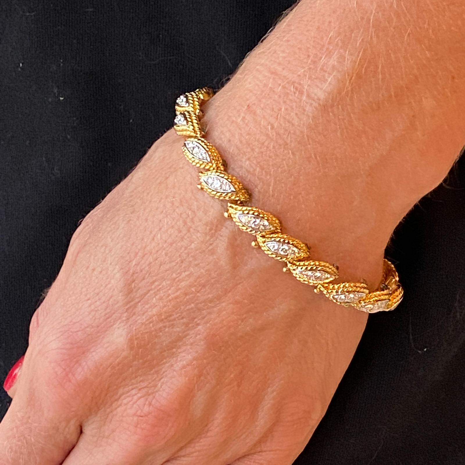 Vintage 18 karat two-tone diamond bracelet.  The bracelet features a rope design link each set with round brilliant cut diamonds.  There is a total of 54 round brilliant cut diamonds weighing approximately 1.62 carats total diamond weight.  Overall