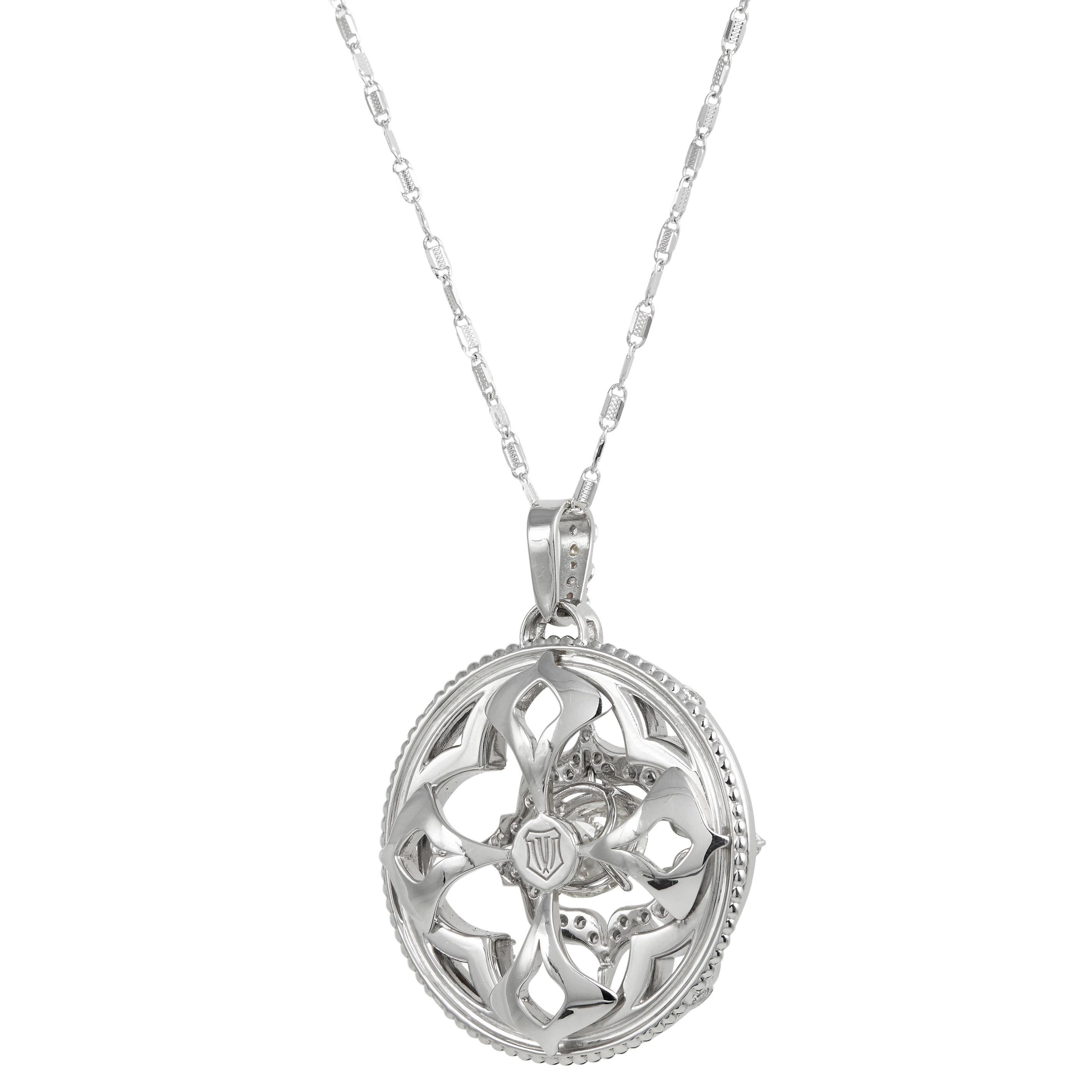 Star Quatrefoil Diamond pendant in 18k gold and platinum surrounded by round brilliant cut diamonds G color and VS clarity with approx. 0.88 CTS with center diamond modern round brilliant cut solitair diamond 3.12 CTS approx. This custom made