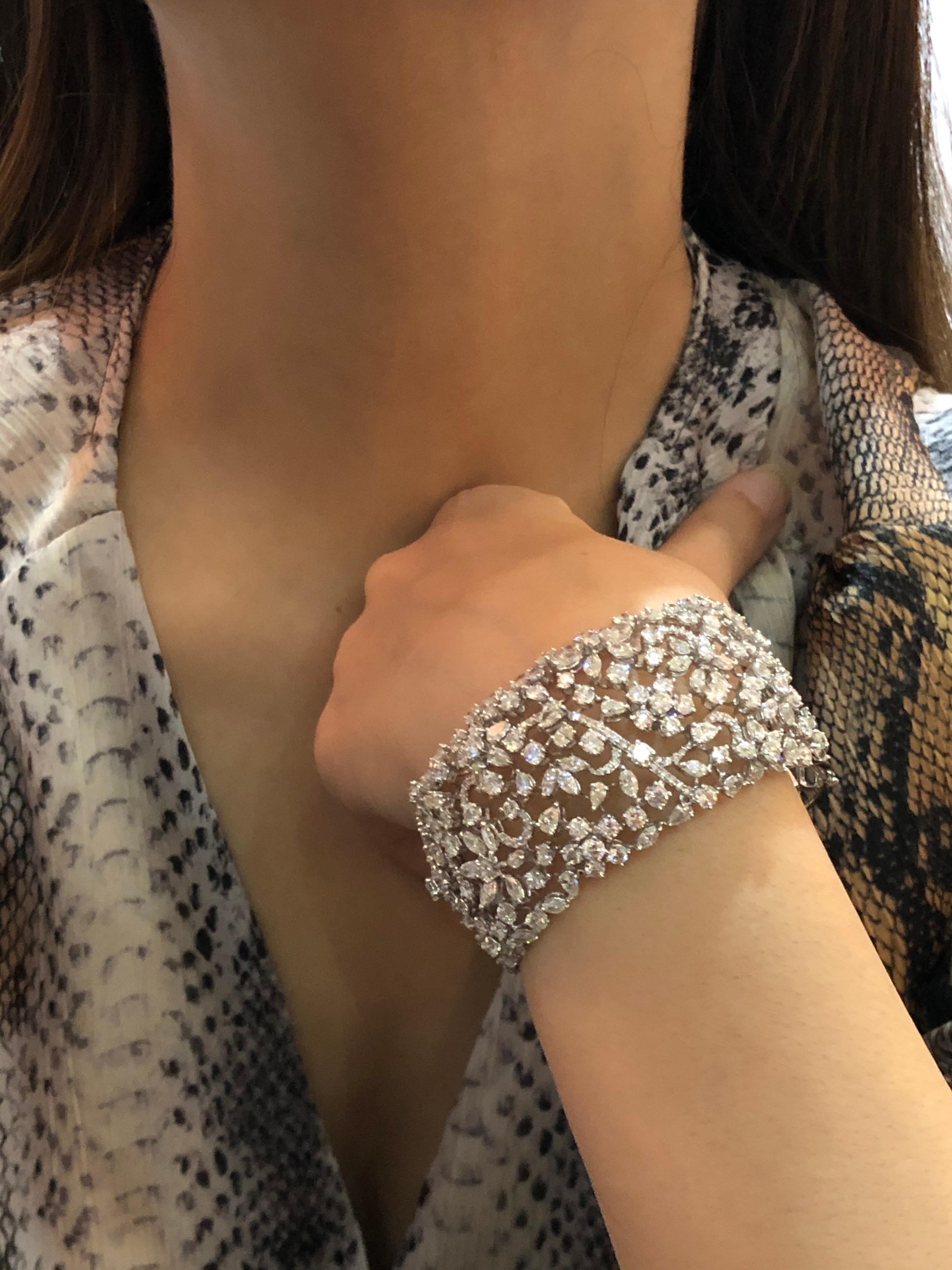 This floral motif beauty inspired by nature is sure to leave you charmed. Allow the freshness of this contemporary design to be a welcome addition to your statement jewellery collection 
Diamond cuff, Diamond Bracelet, Fancy shaped diamonds, Bridal,