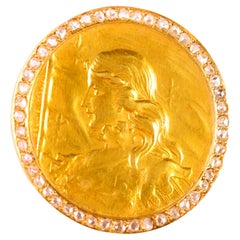 Diamond 18k gold depicting French lady liberty coin brooch
