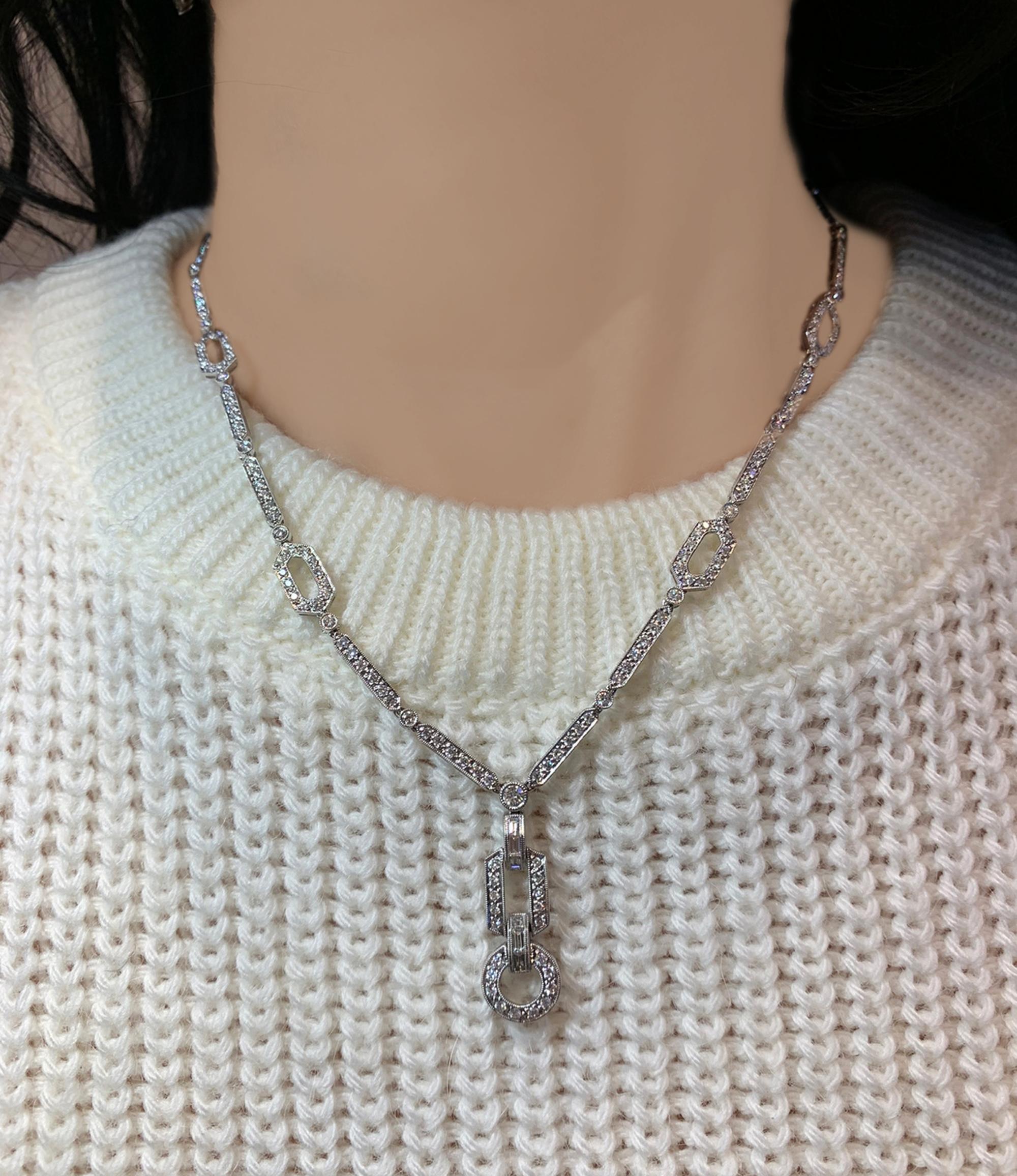 This Contemporary Diamond Pave Articulated Lavalier Necklace has a unique combination of elements from jewelry history yet is sparkles and coheres like an exquisite modern piece. Crafted in 18K white gold in the 21st century, circa 2000s, the