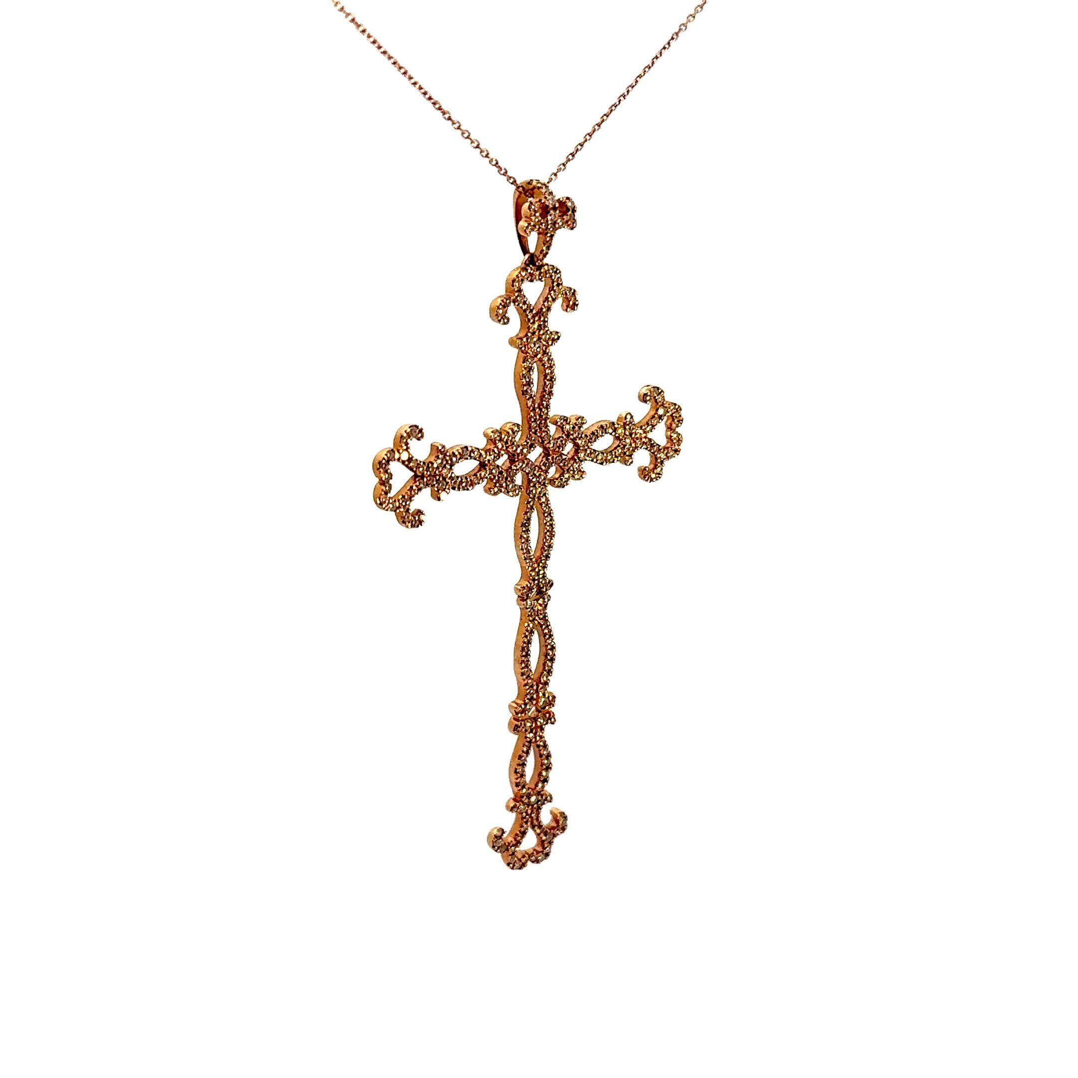 An elegant and intricate cross pendant featuring 1.28 carats of round brilliant-cut white diamonds. The diamonds are set in a detailed, ornate pattern, enhancing the pendant's sophisticated design which showcases detailed filigree and lacework.