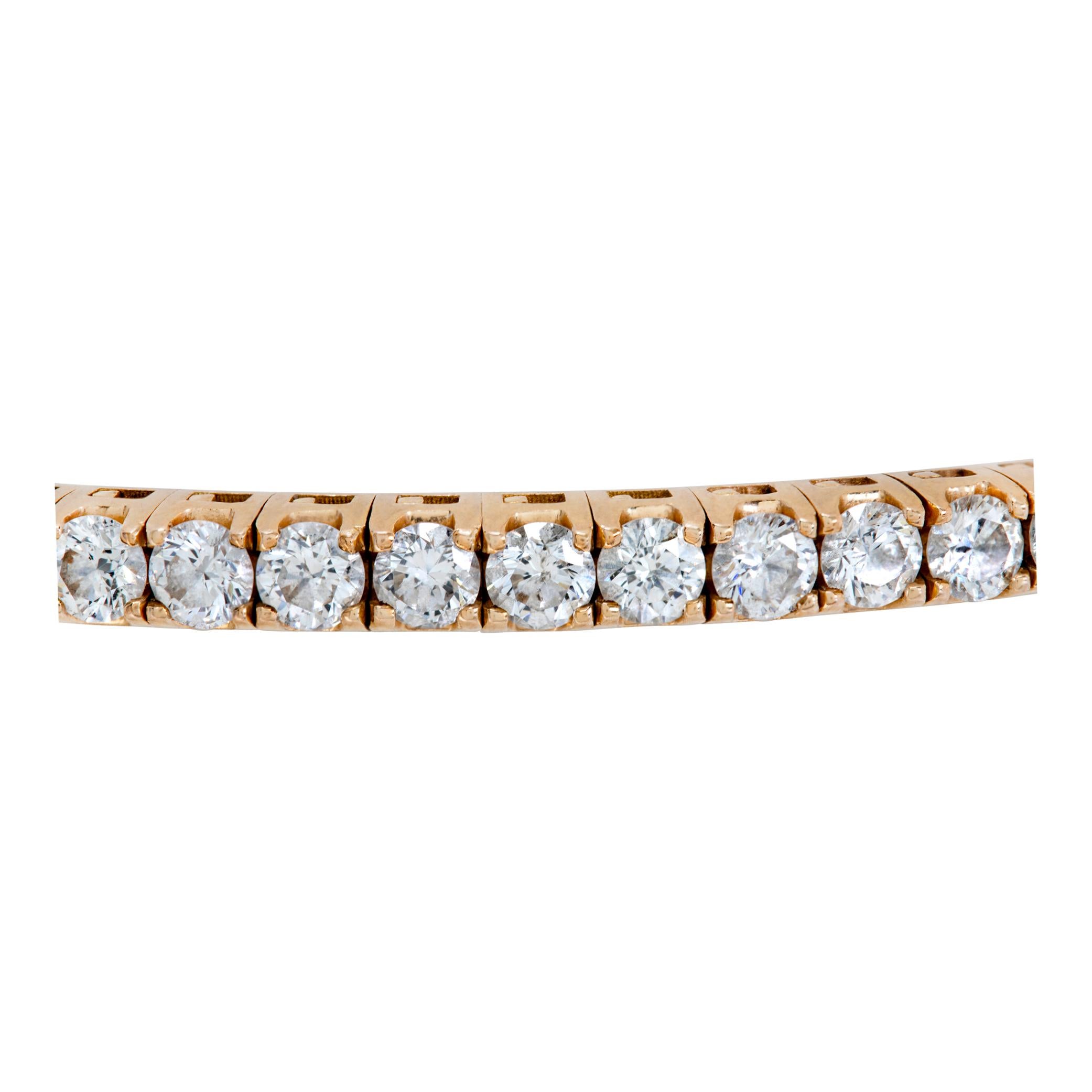 Round brilliant cut diamonds flexible bangle bracelet in 18K rose gold. Round brilliant cut diamonds total approx. weight over 6.00 carats, estimate: G-H color, VS-SI clarity. 1/8 inch wide. Will fit up to a 6.5