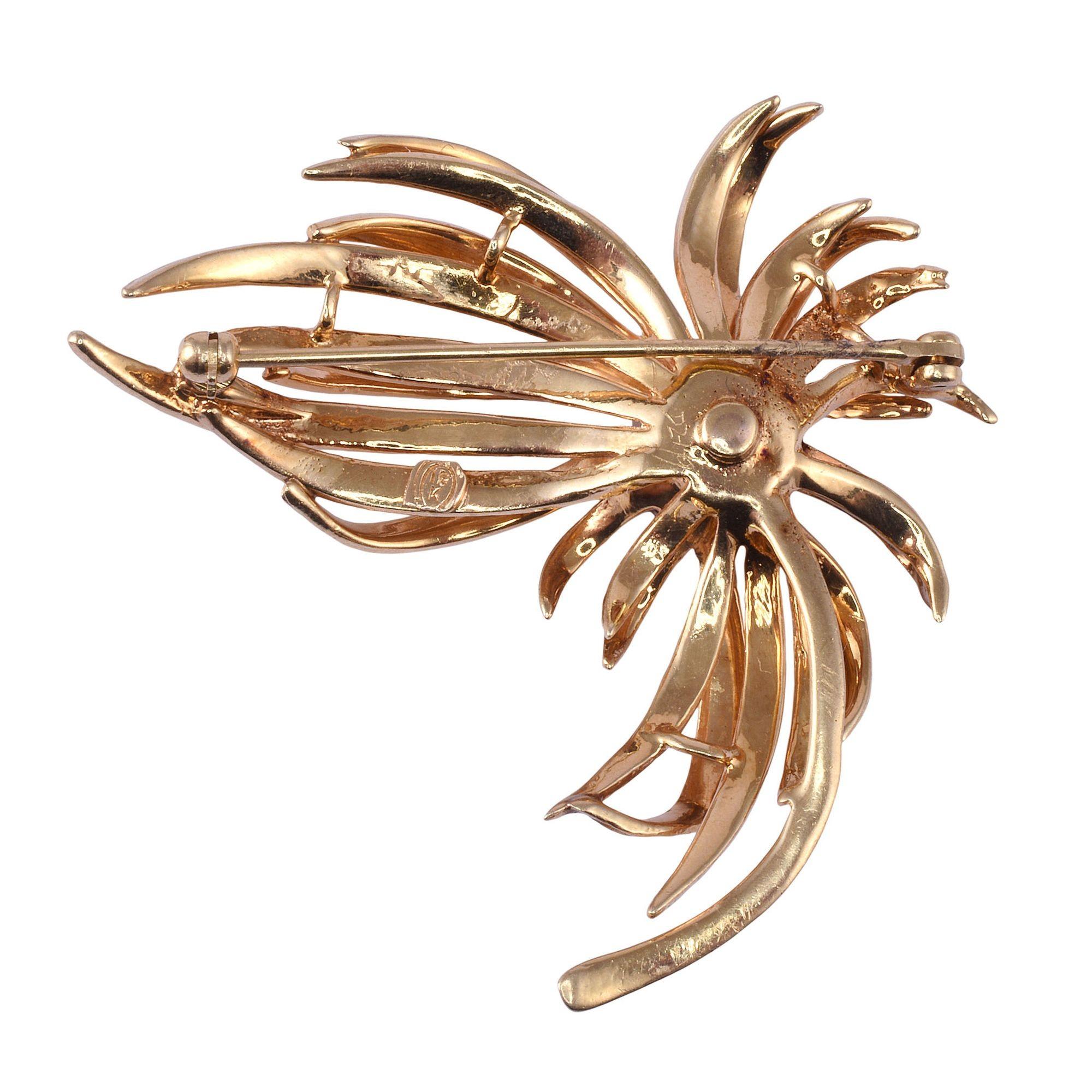 Vintage diamond 18K spray brooch, circa 1970. This vintage brooch is crafted in 18 karat yellow gold. The spray style brooch features a cluster of diamonds with a .18 carat center diamond and .48 carat total weight of surrounding diamonds, for a .66
