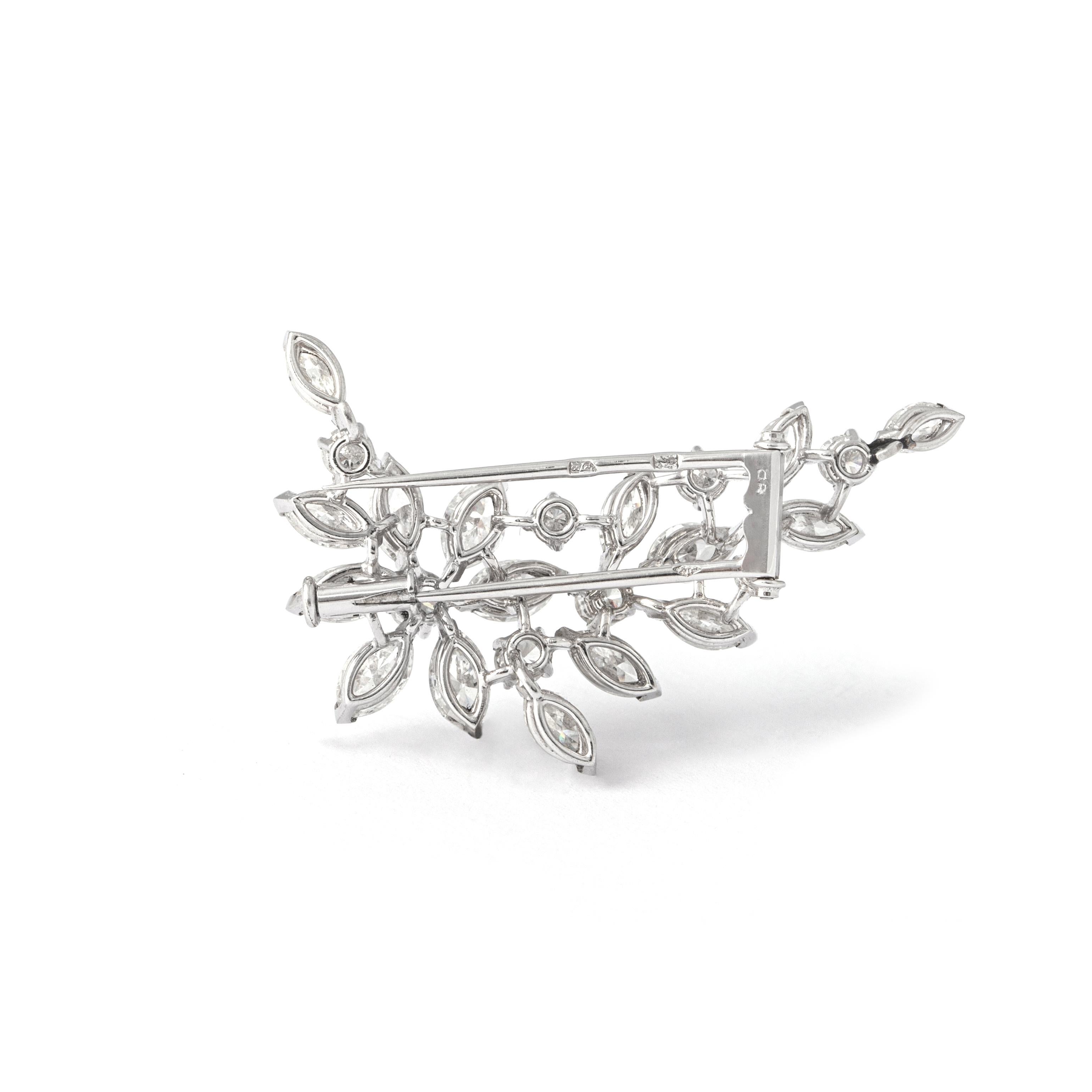 Indulge in the timeless allure of our Diamond 18K White Gold Brooch—a masterpiece of sophistication and brilliance.

This exquisite brooch boasts a harmonious blend of diamonds, with 8 round-cut diamonds weighing approximately 0.95 carats in total,