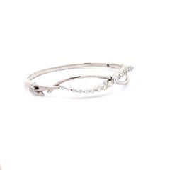 Bracciale a nastro infinito con diamanti in oro bianco 18 carati