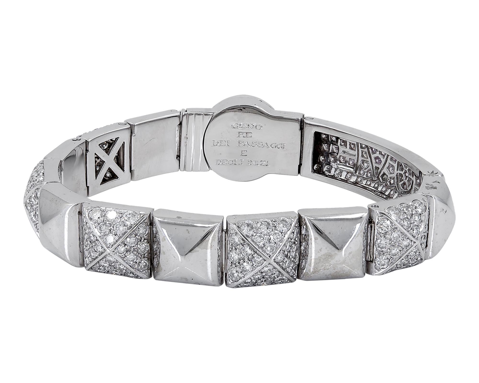 A beautiful bracelet designed as a straight line of squarish salient platinum links alternating with diamond pave-set links to longish pave-set link with the word 