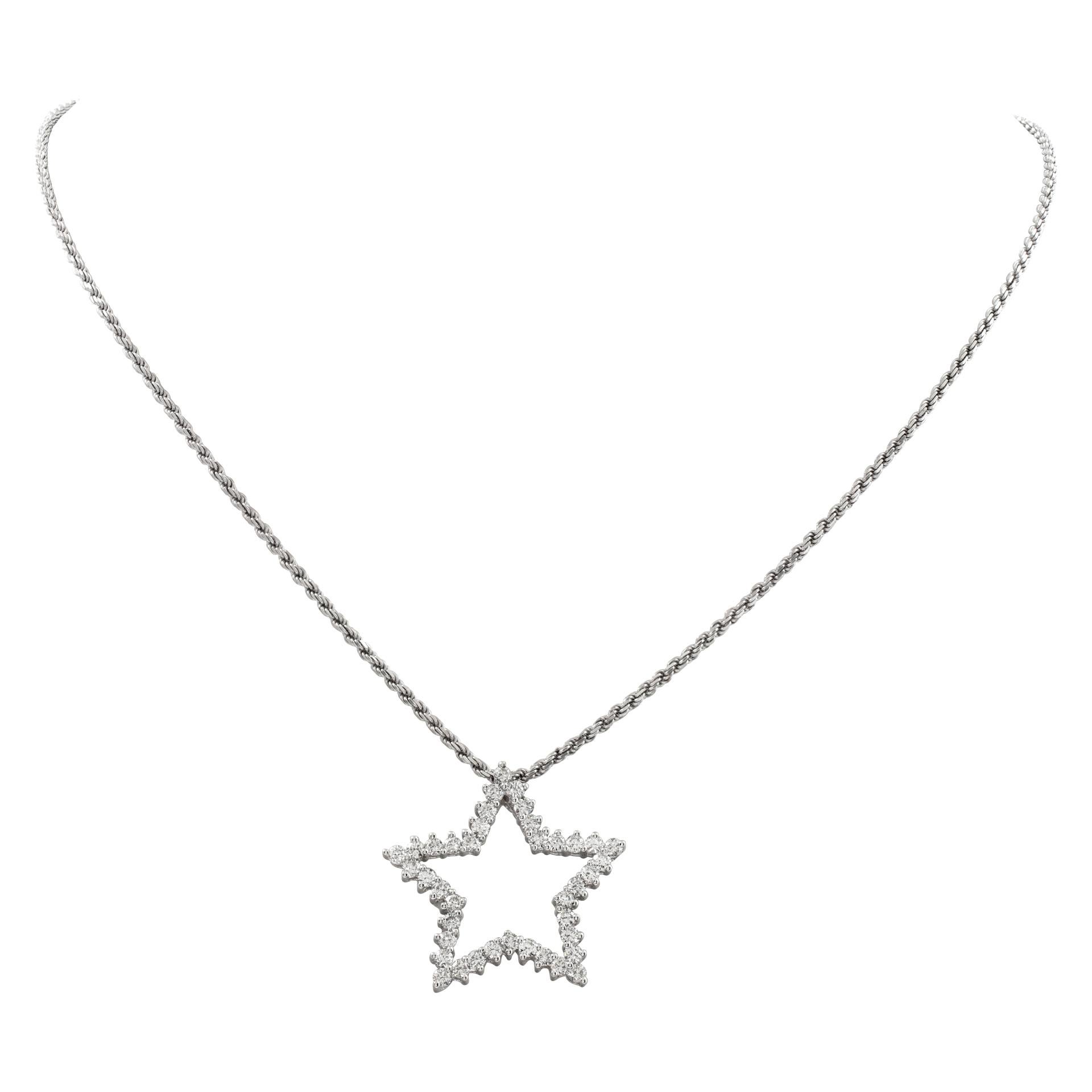 Diamond star pendant in 18k white gold on an 18k white gold chain. Over 1.60 carats in round diamonds (G-H color, VS-SI clarity). 1 inch width star pendant. 16 inch length chain.