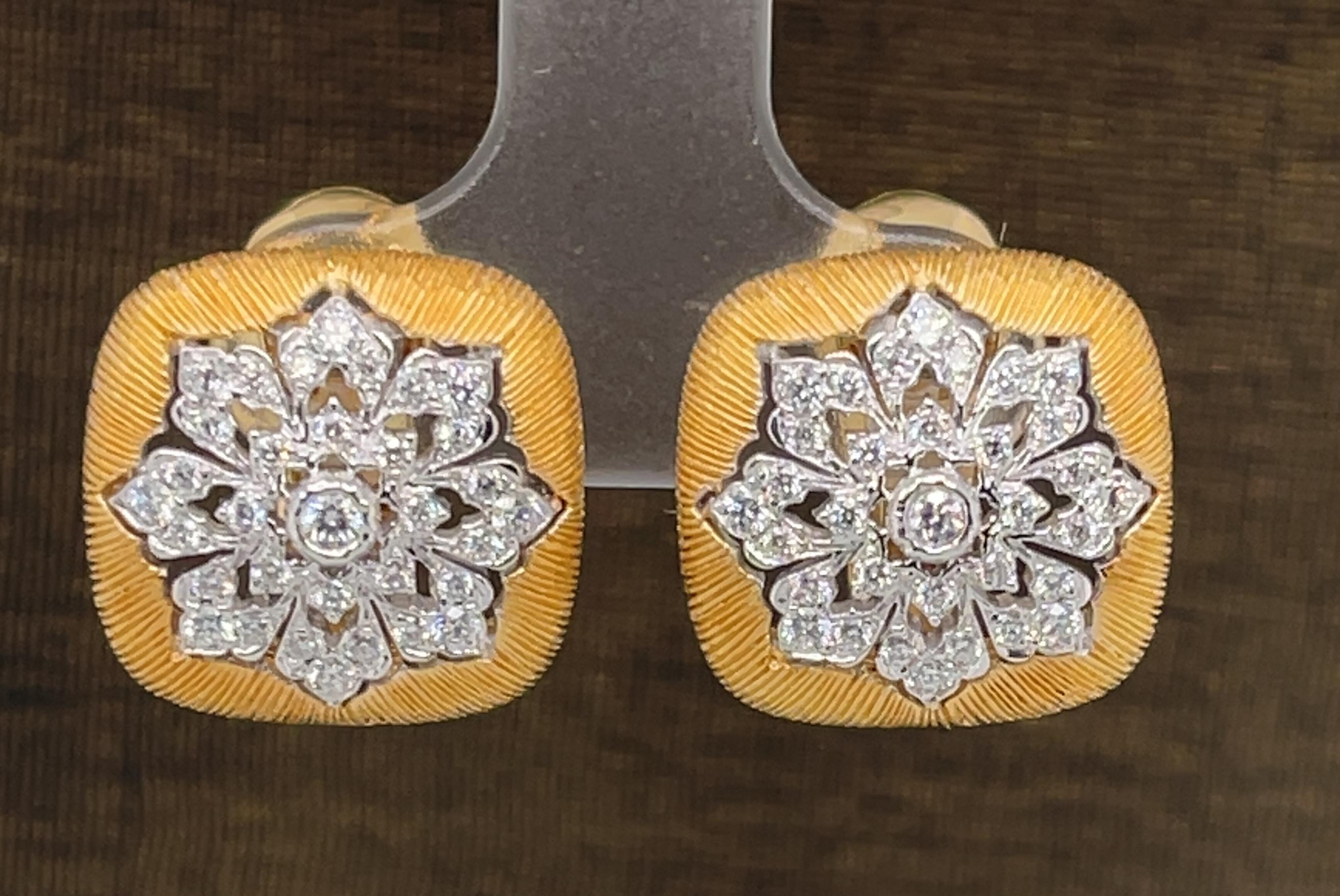 These Florentine inspired earrings feature bright, sparkling diamonds set in 18k white and yellow gold with French clip backs. Brilliant diamonds are set in a floral starburst against an exquisite hand-