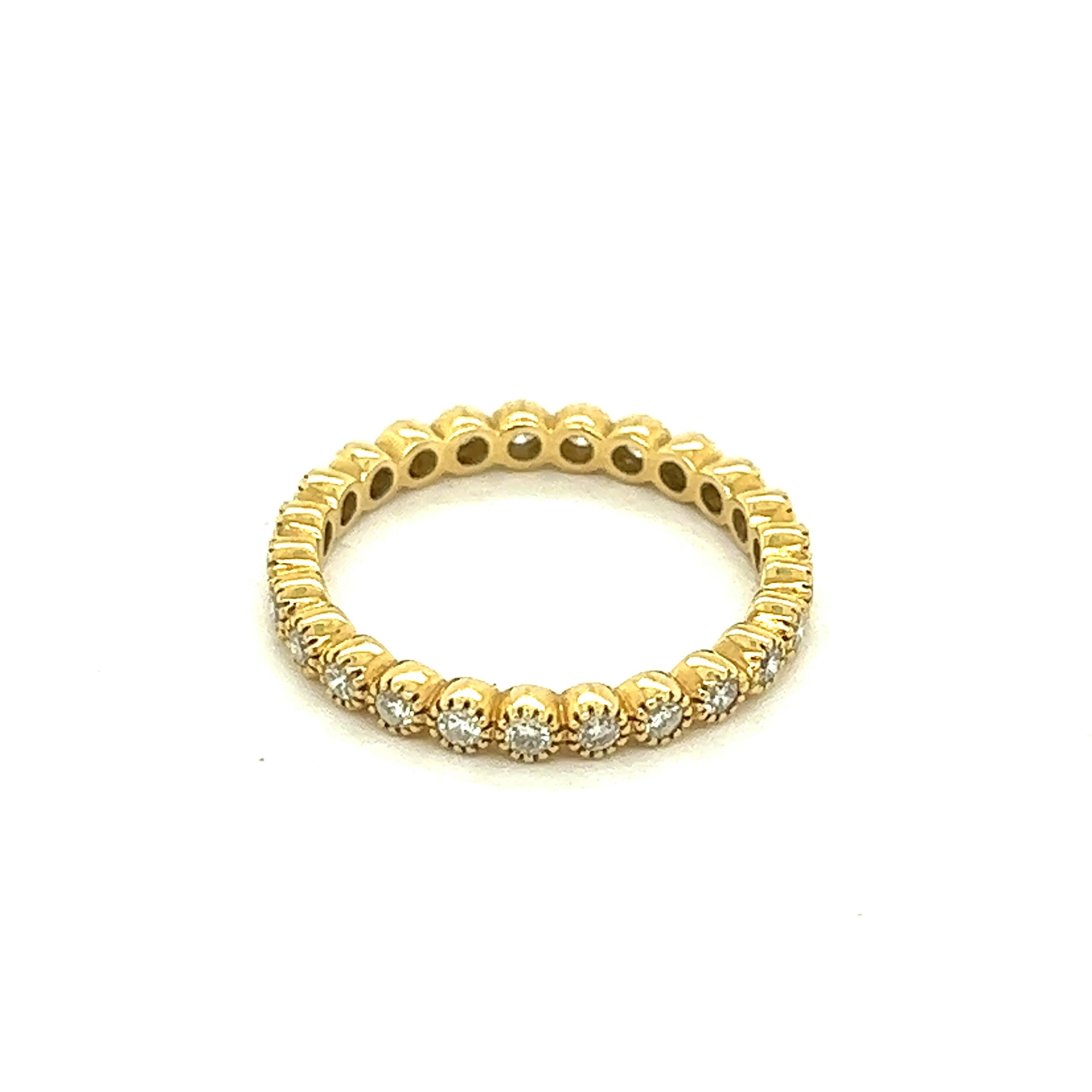 Diamond 18k Yellow Gold Band Ring

Twenty-five round-cut diamonds of approximately 0.75 carats, set on 18 karat yellow gold

Size: 7 US
Total weight: 2.3 grams