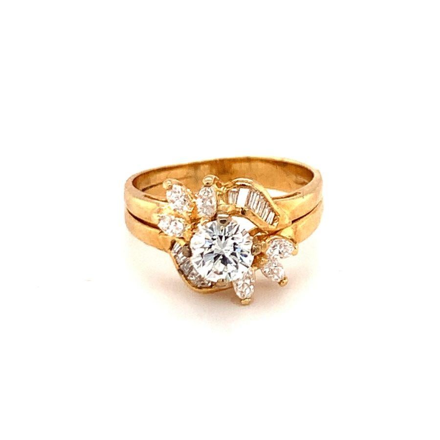 One diamond cocktail 18K yellow gold ring centering one prong set, round cut diamond weighing approximately 0.61 ct. as well as marquise and baguette diamonds weighing approximately 0.92 ct.

Flair, sparkling, shine.

Additional information:
Metal: