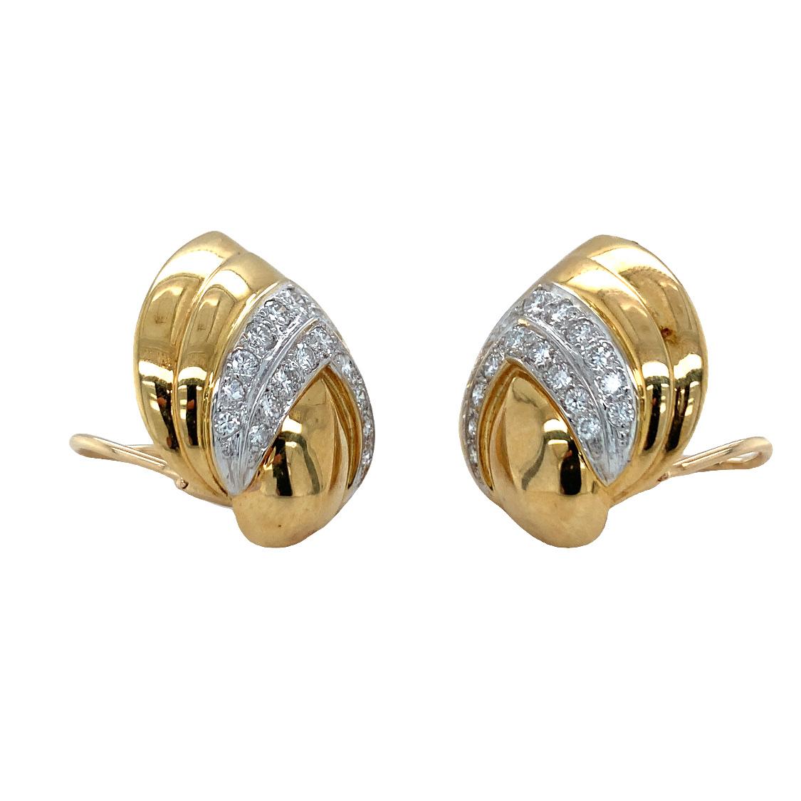 One pair of diamond 18K yellow gold earclips featuring 40 round brilliant cut diamonds totaling 1.35 ct. enhanced by a high polish finish. Circa 1970s.

Lovely, luxurious, statement.

Additional information:
Metal: 18K yellow gold
Gemstone: Diamonds