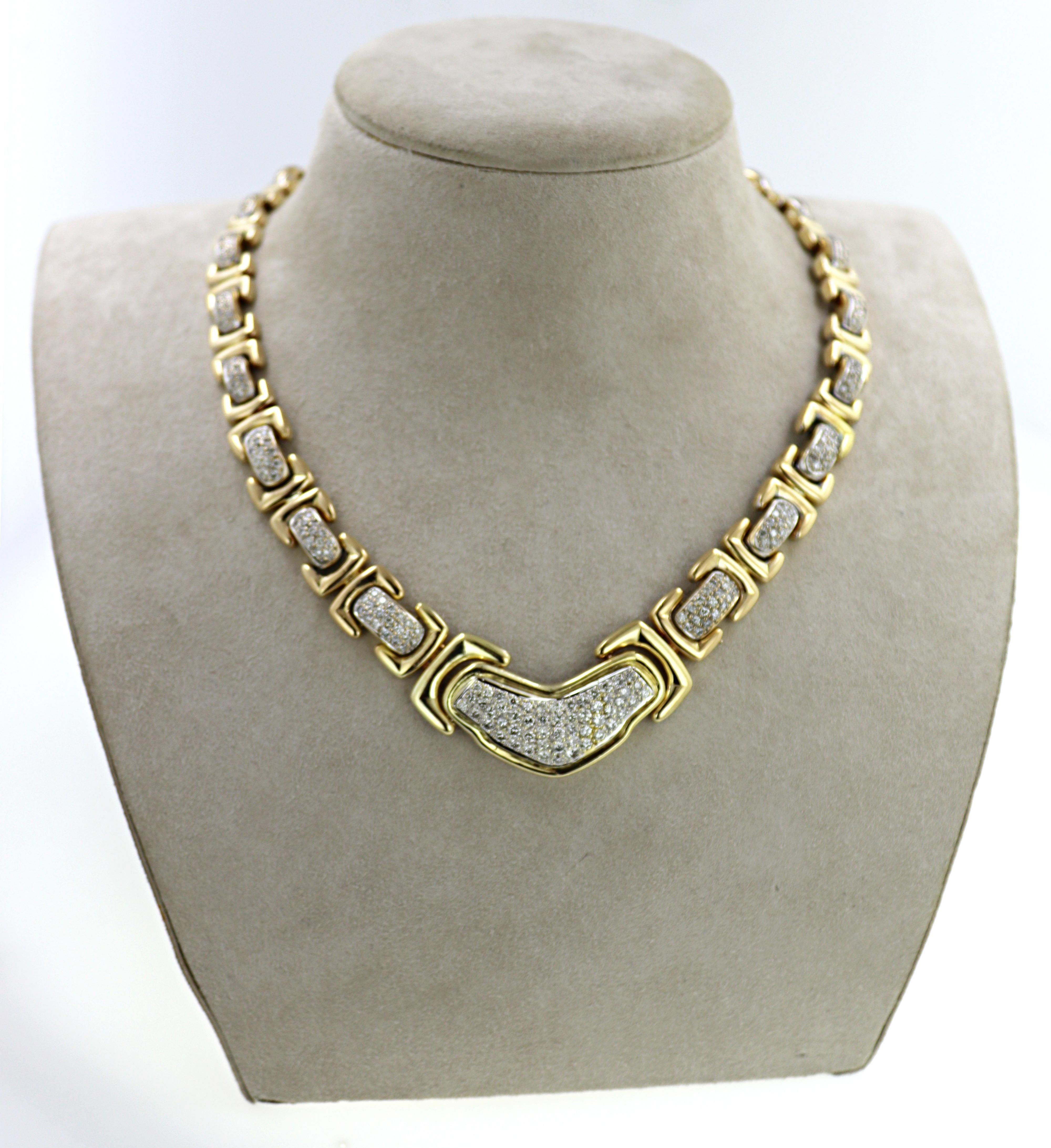 Featuring 300 full-cut diamonds, 4.75 cts. tw., bead set in an 18k yellow gold tapering
articulated buckle style link mounting, 15.2 mm to 3.7 mm, completed by a tongue and groove
clasp, with figure eight safety, forming a 16-inch necklace, Gross