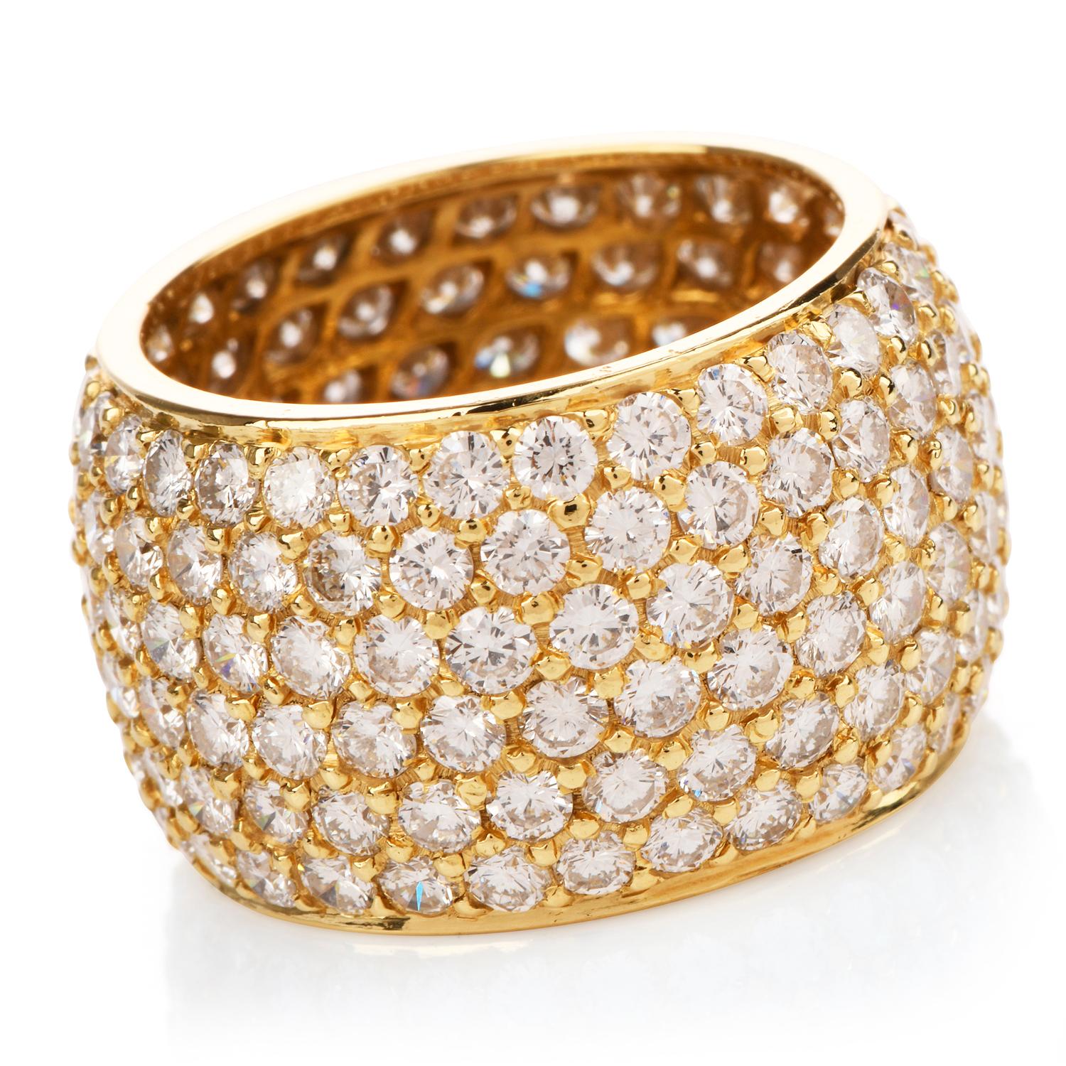 This Stylish diamond eternity ring is crafted in solid 18-karat yellow gold, weighing 8.0 grams and measuring 13mm x 7mm high. Pave-set with approximately 200 round-cut diamonds, collectively weighing approximately, 7.60 carats, graded G-H color and