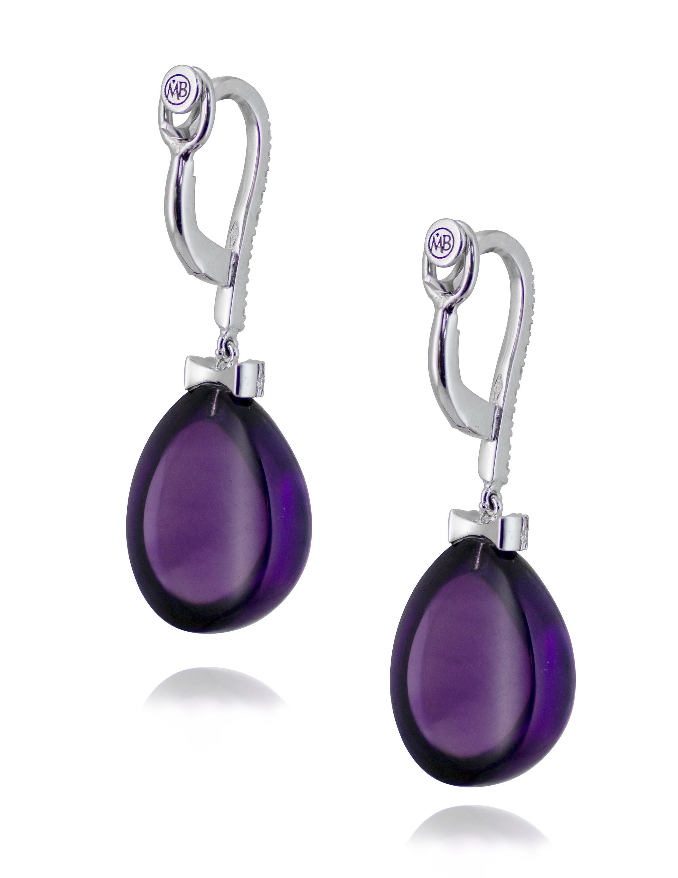 Handcrafted in Margherita Burgener family workshop, based in Italy,  the Gattopardo earrings are characterized by  cabochon cut pendant drops in Amethyst  and a hook in white gold set with high quality diamonds. 

Gattopardo earrings are inspired by