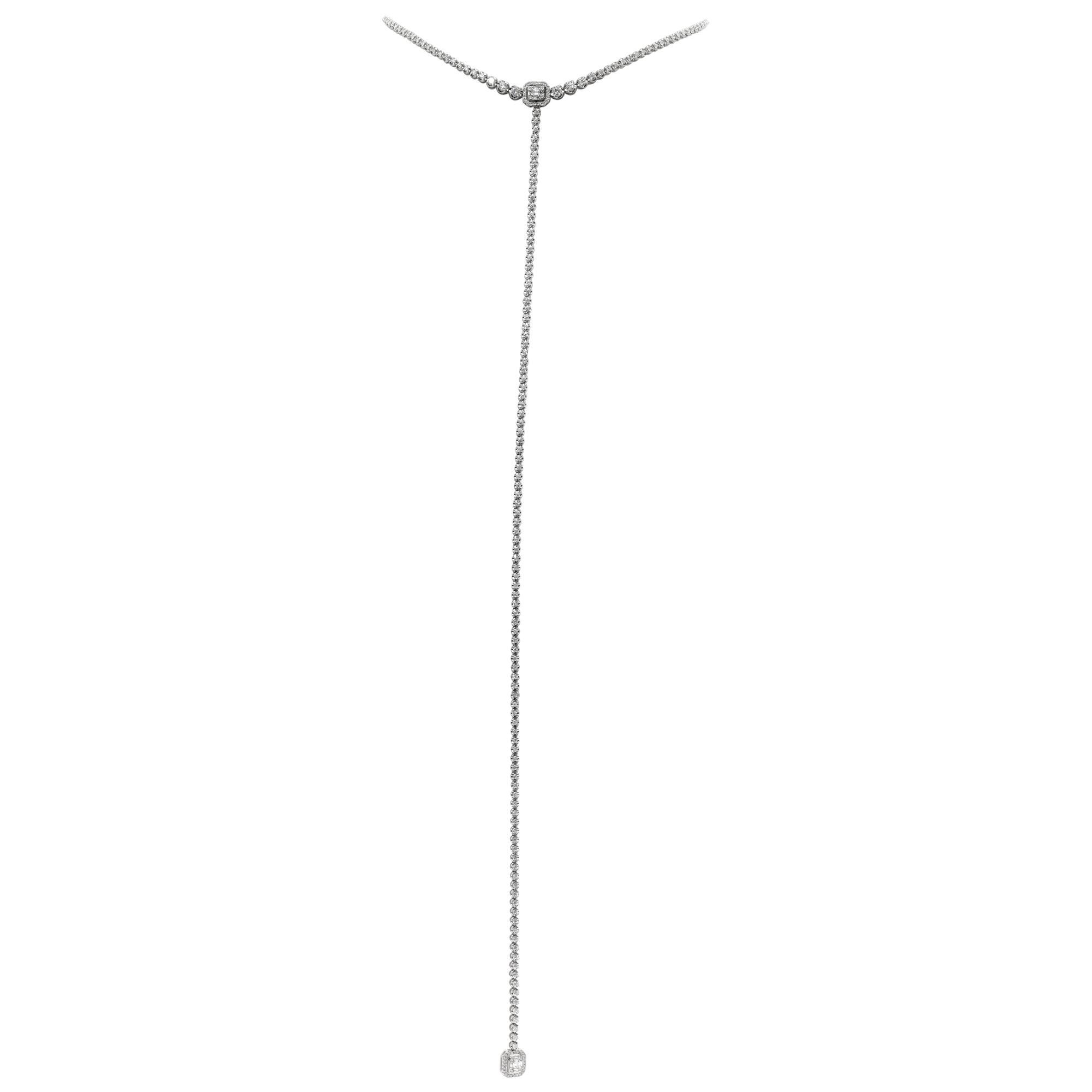 Round brilliants cut diamonds, long Lariat necklace in 18Kt white gold with 2 baguettes & round illusion motif center. Baguette and round brilliant cut diamonds total approx. weight: 4.72 carats, Graduating diamonds necklace is 16 inches long. The