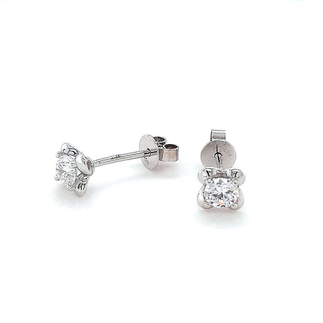At the heart of each earring is  a dazzling 0.2ct diamond nestled within the delicate petals of the lily of the valley design, crafted in 18ct white gold.

- Size (LxW): 5.7 × 5.7 × 16.6 mm
- Weight per earring: 0.7g

Fei Liu Fine Jewellery is an