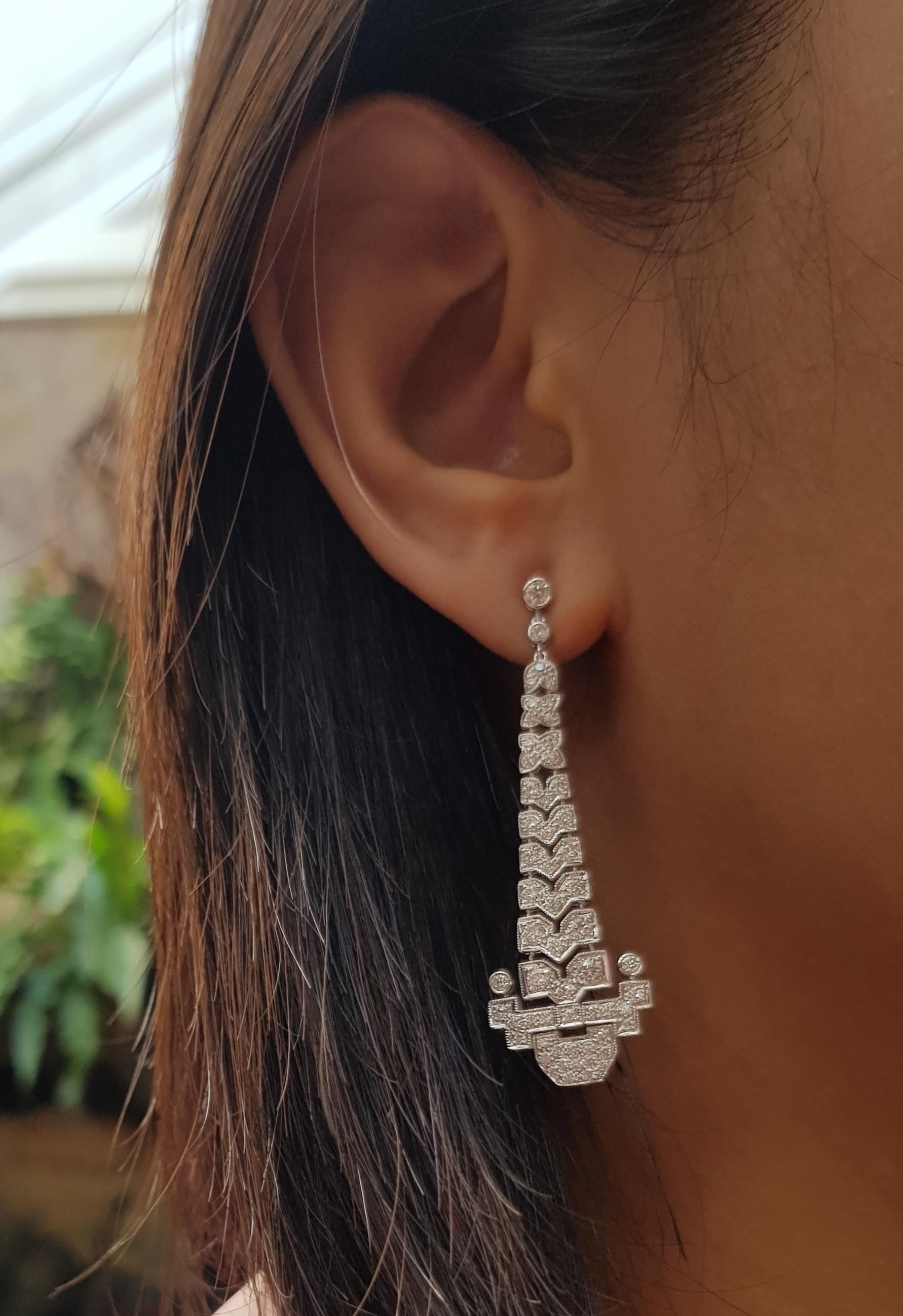 Diamond 2.14 carats Earrings set in 18 Karat White Gold Settings

Width:  1.2 cm 
Length: 5.2 cm
Total Weight: 12.07 grams

