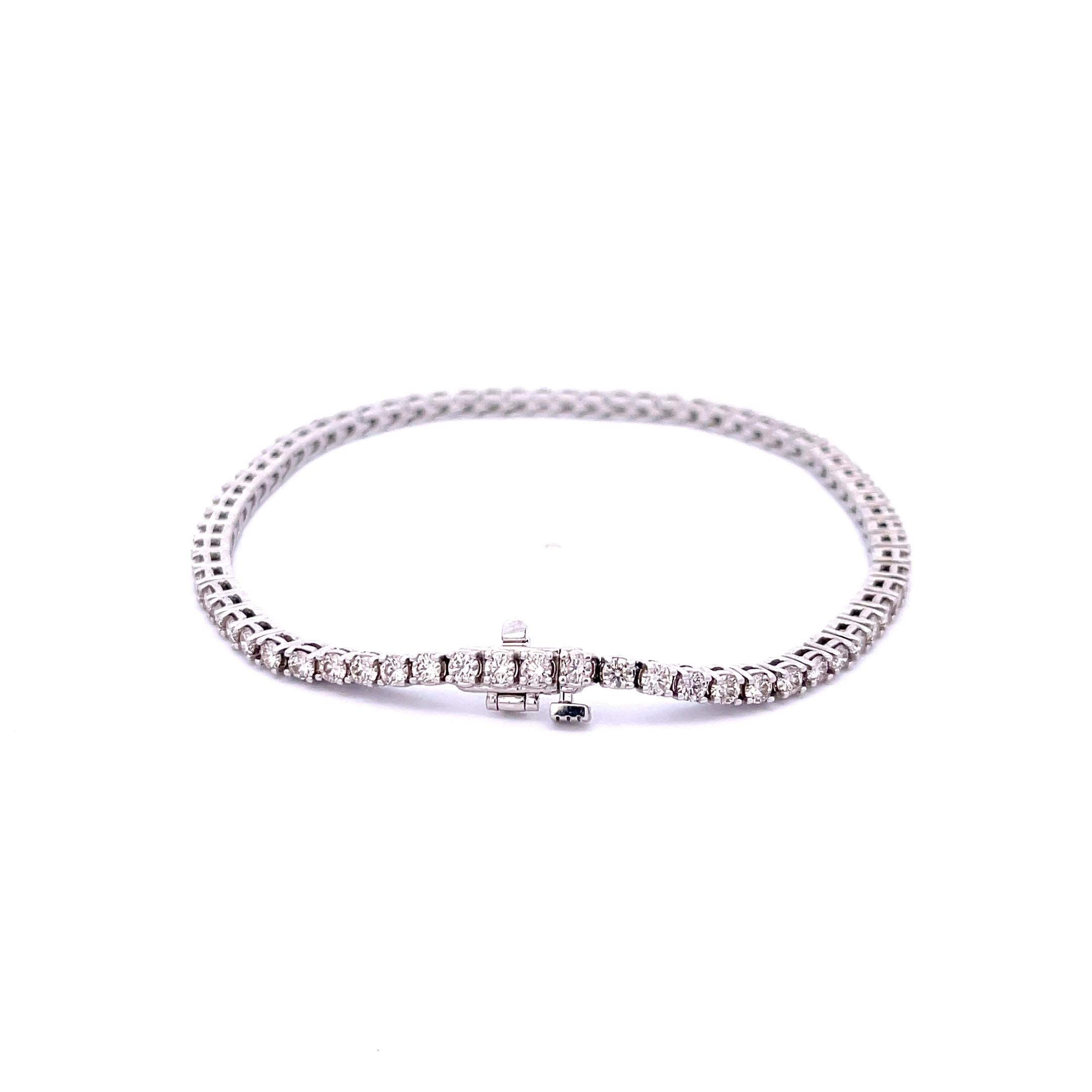 Diamond Tennis Bracelet in 14K White Gold. The bracelet features 2.82ctw of brilliant round diamonds, I color, SI clarity. The bracelet is 7