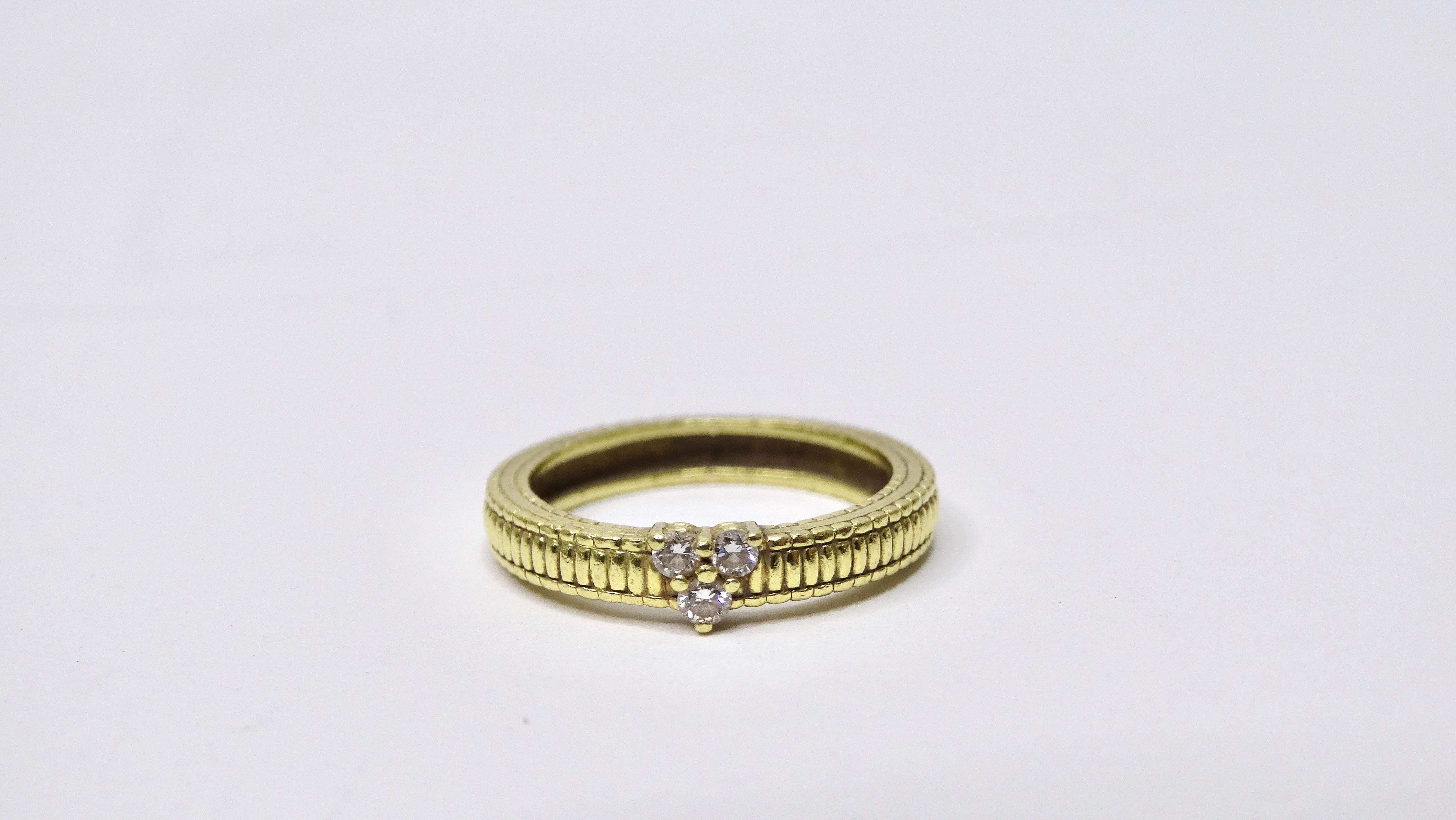 Everyone needs a diamond gold ring in their jewelry collection! This petite ring will layer perfectly with any of your other rings. This features a textured gold band that is still in great vintage condition paired with three diamonds placed in a