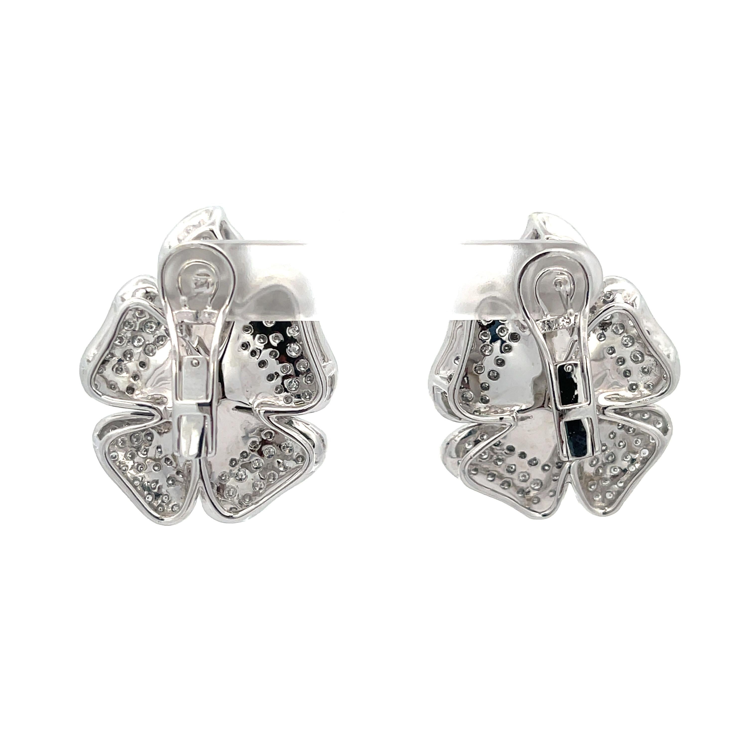 Diamond Flower Earrings in 18K White Gold. The earrings feature approximately 3.75ctw of round cut diamonds, G color, SI1-SI2 clarity. 
41.7 grams
1.5