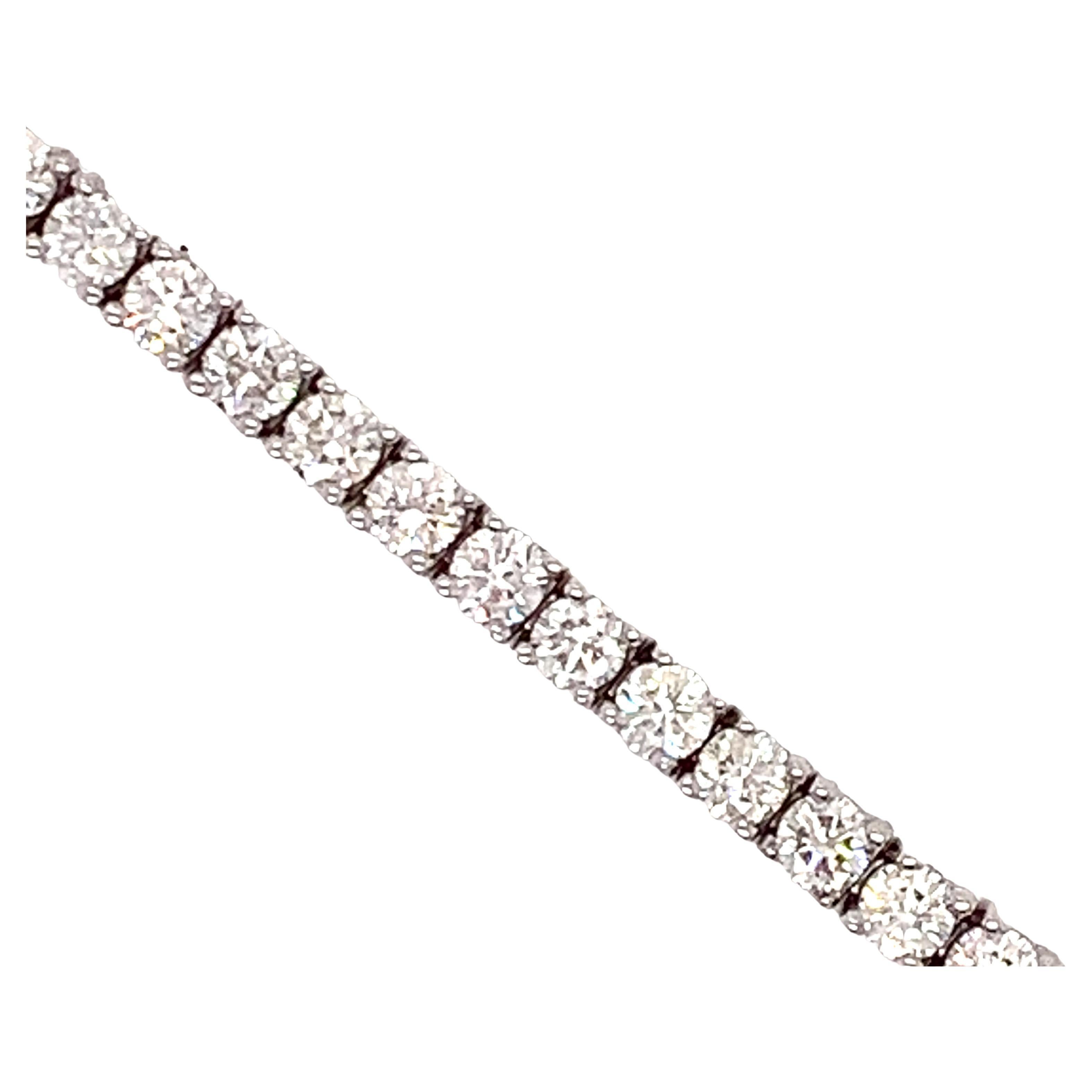 Whether it's your first diamond tennis bracelet or you collect them, this classic beauty is 6.45 cttw in round diamonds. There are fifty three diamonds.  These are SI clarity with a G-H color. The diamonds are mounted in 10.41 grams of 14 kt white