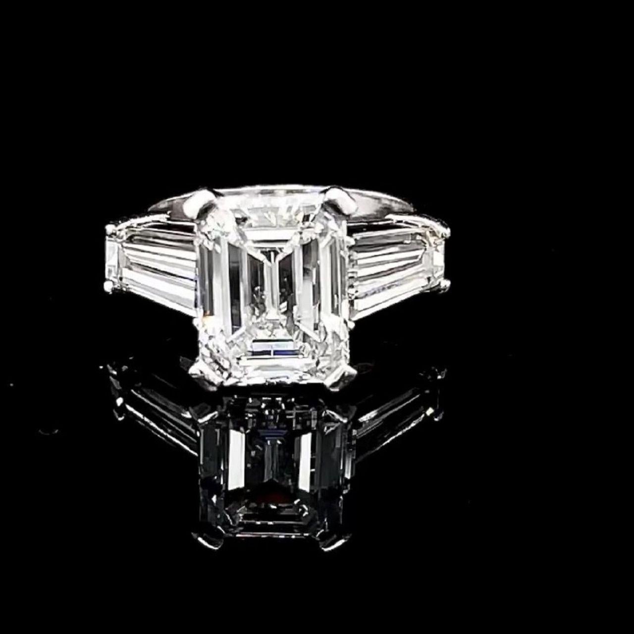 Diamond Emerald Cut Engagement Ring. 

Spectacular. 

Emerald Cut Diamond weighs 3.97 carats 

F Color VS1 Clarity  with GIA Certificate # 8473905

Tapered Baguette Diamond weighs 1.41 carats D Color VVS1 Clarity 

With GIA certificate #