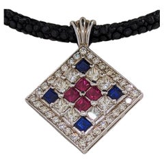 Diamond '8sq=1.31 +32=0.71 Cts' Rubies '4sq=0.82cts' Sapphires'4sq=0.86cts' Pend