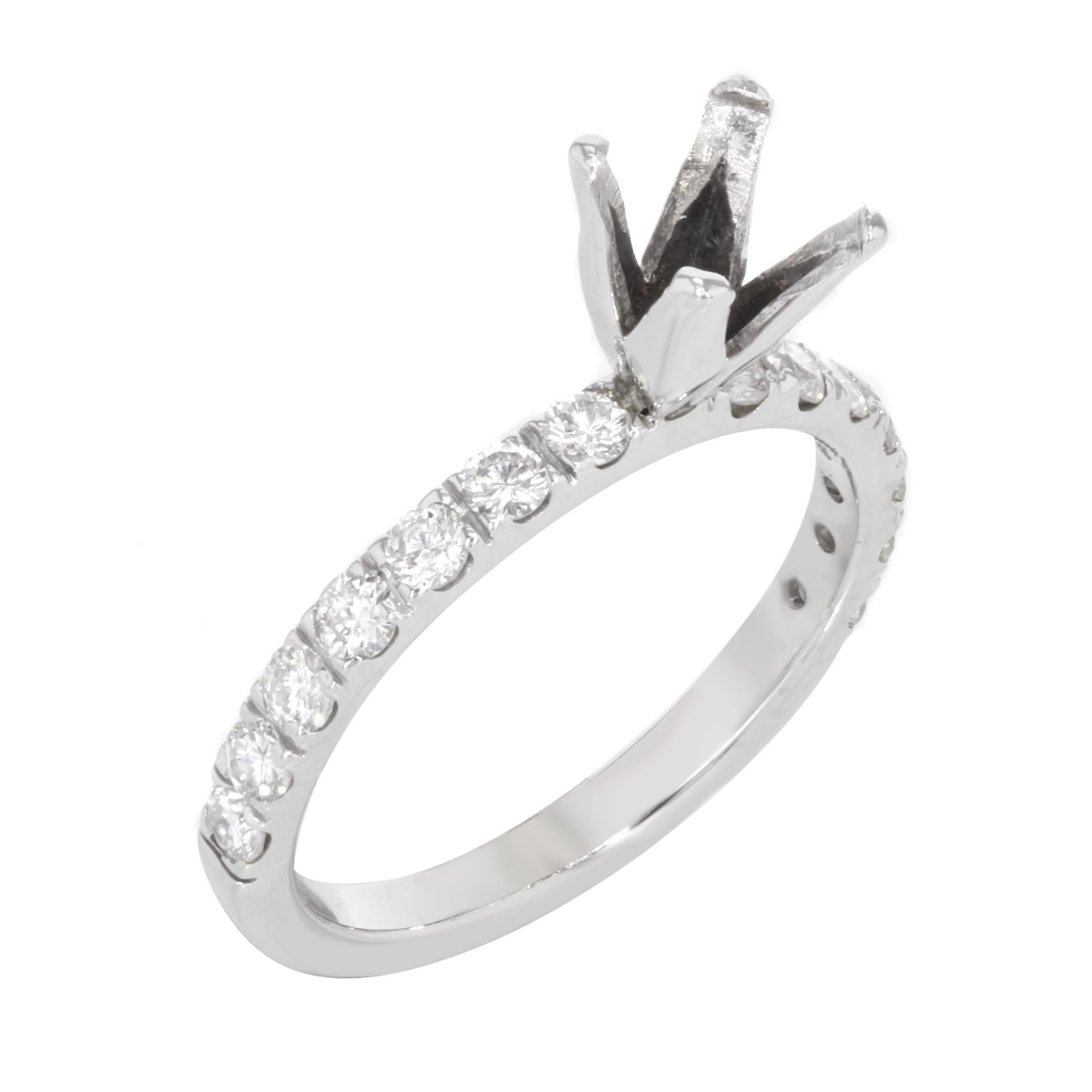 This beautiful 14k white gold engagement ring setting features a 4 prong setting mounting with 7 accented round cut stones on both sides weighing approx. 0.75 Cttw. Ring size 7 (sizable). Total weight: 2.5 gms. Comes with a presentable gift box.
All