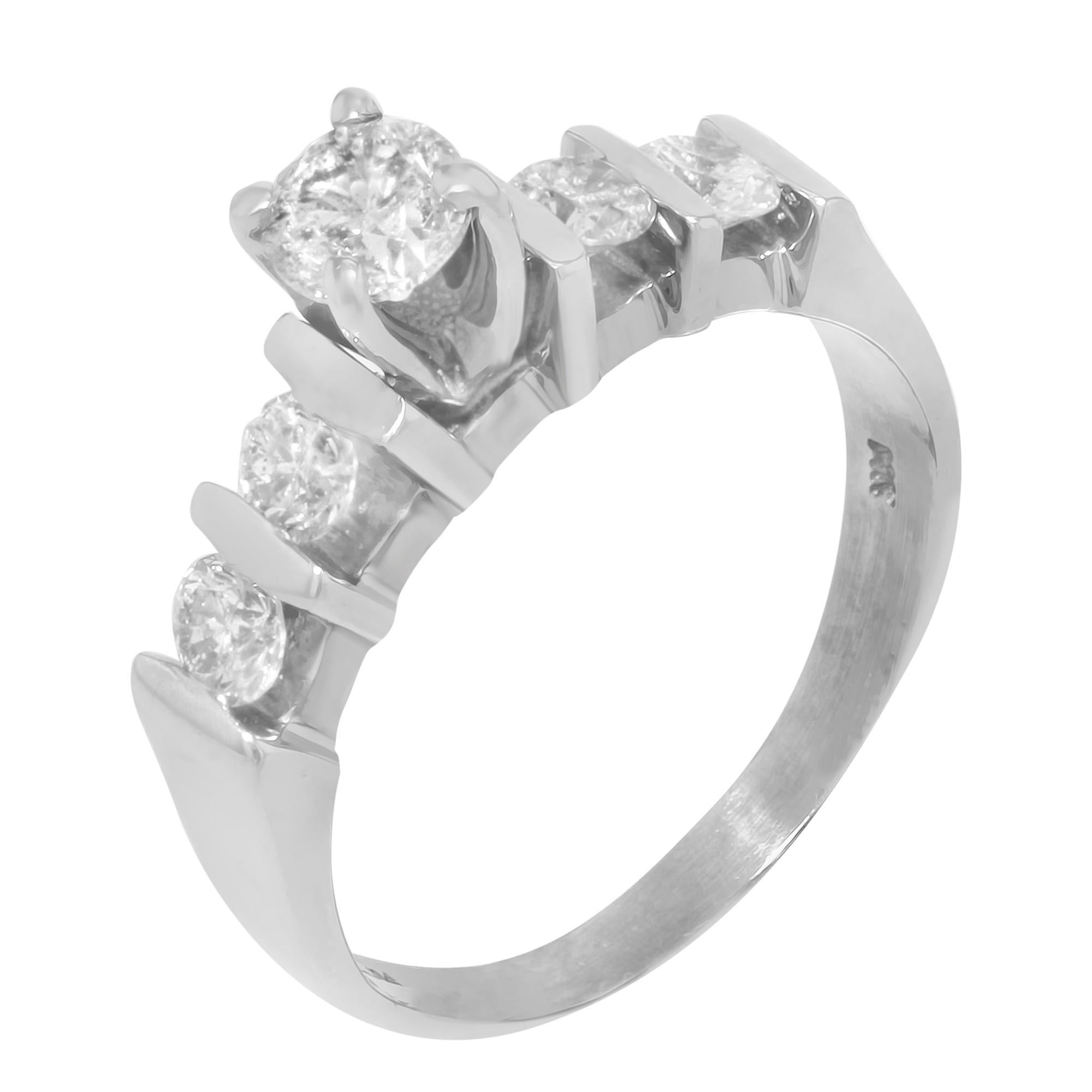 This gorgeous diamond engagement ring is encrusted with a center prong set round cut white diamond and accented with two round cut diamonds on each side in bar setting. Crafted in high polished 14K white gold. Total diamond weight: 0.86ct. Ring size