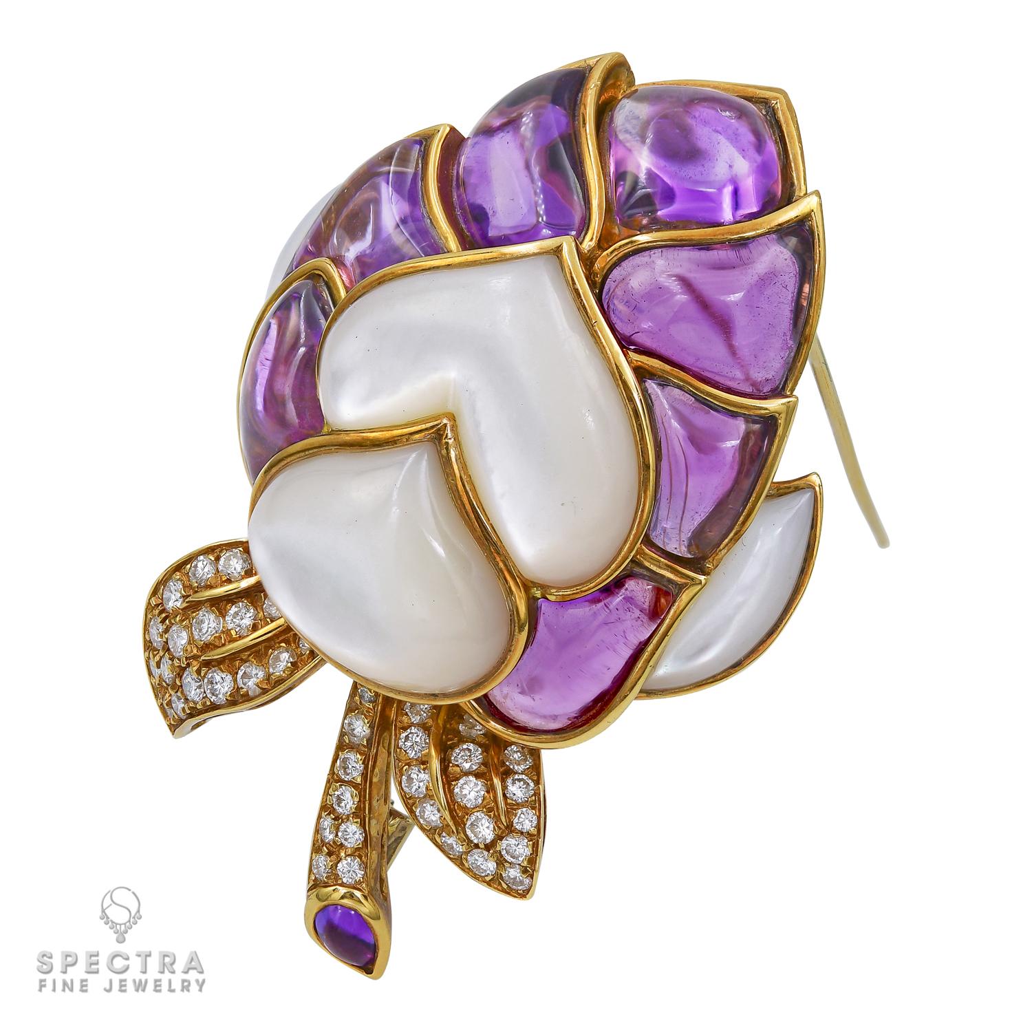 A beautiful brooch with beautiful amethyst stones and mother-of-pearl sitting closely together. Forty four diamonds are set in the leaf design. 
The metal is 18k yellow gold, gross weight 55.5 grams.
Measurements:
L: 2.5 in (6.5 cm) 
W: 1 3/4 in
