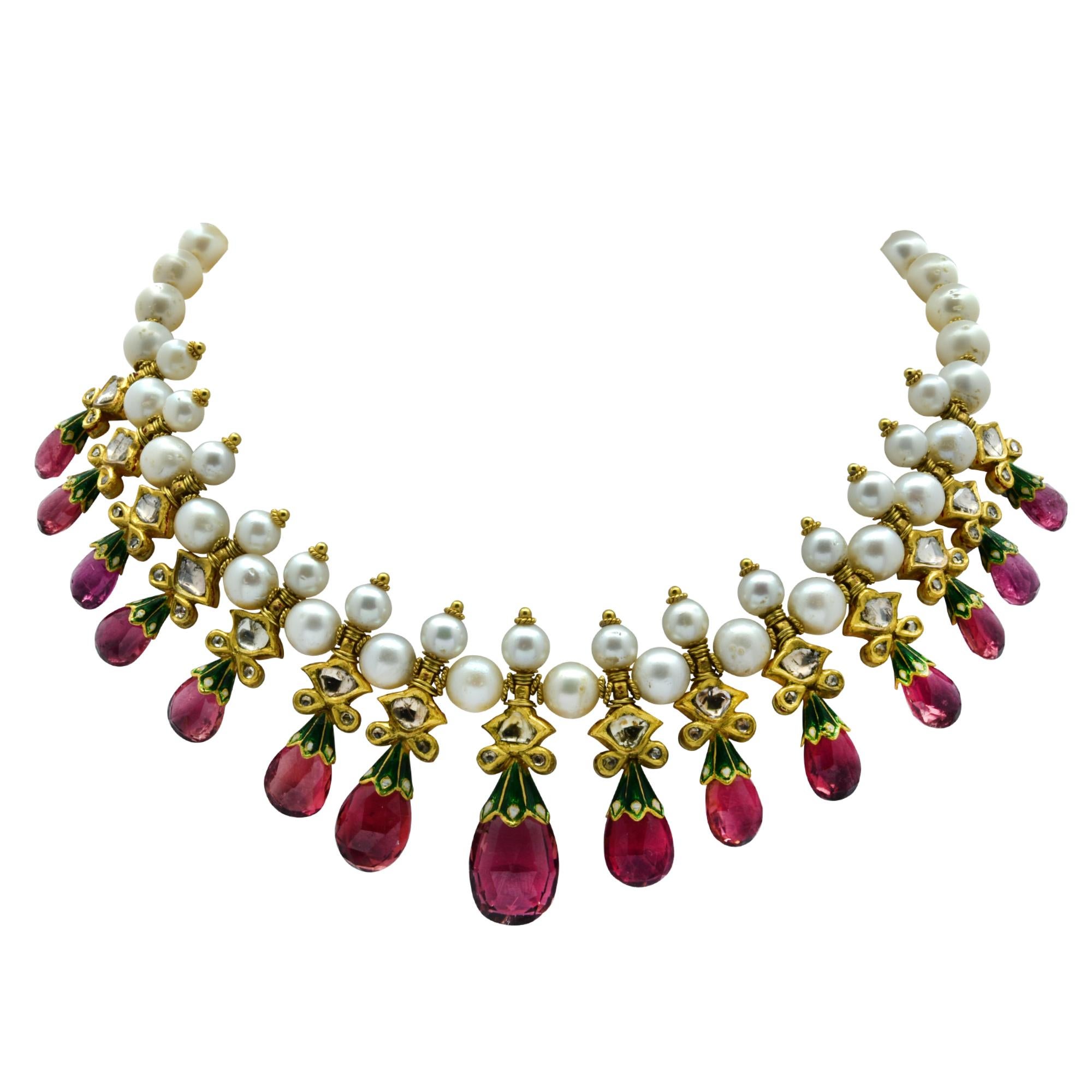 22k gold and enamel bib style necklace featuring approximately 100cts of tear drop Amethyst, 4cts of rose cut diamonds, L-M color I1 clarity and 6.5-8.5mm freshwater pearls.  

Our pieces are all accompanied by an appraisal performed by one of our