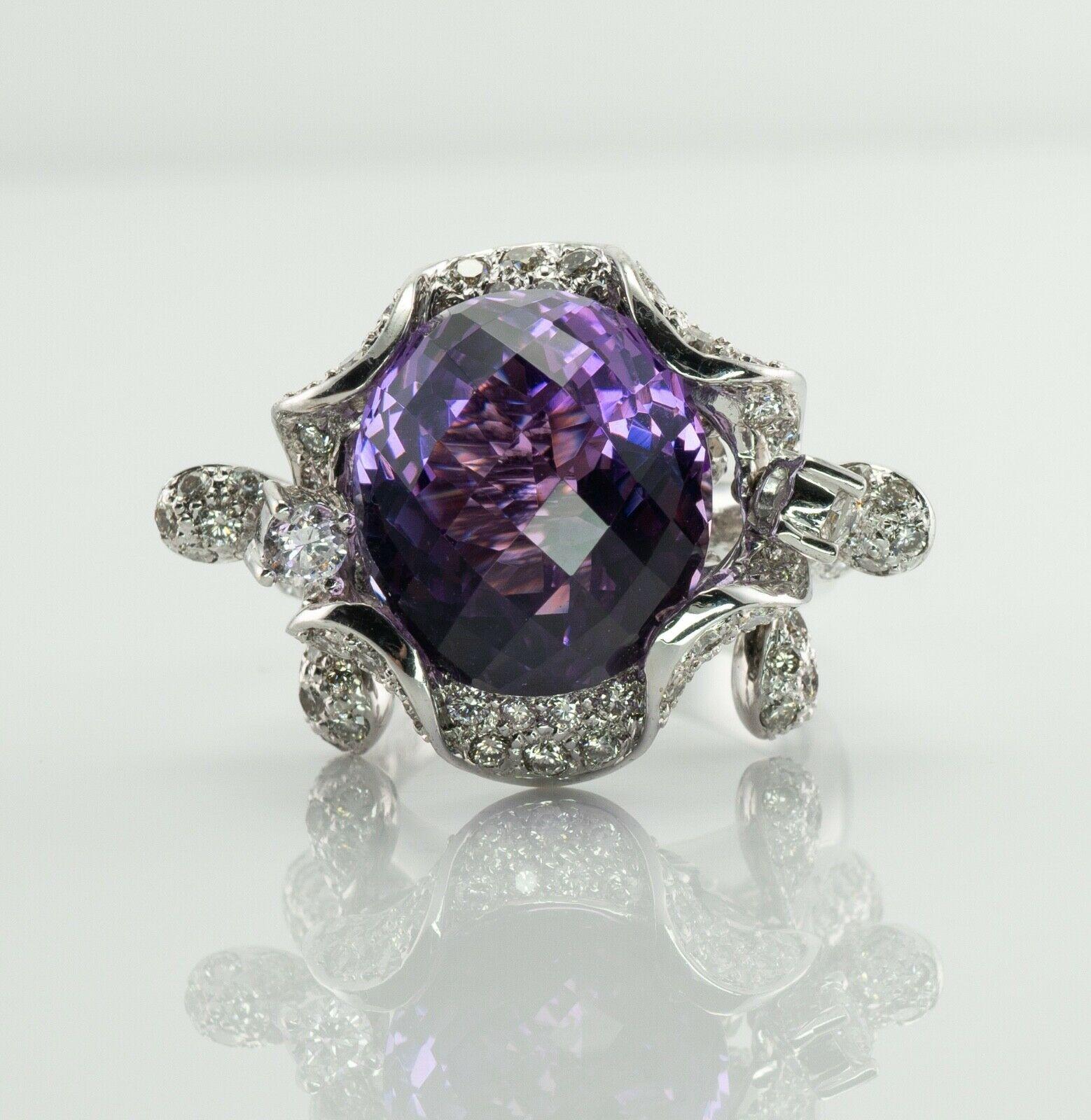 This amazing large and spectacular ring is crafted in solid 18K White Gold. The center natural checkerboard cut Amethyst measures 15mm x 13mm = 10.28cts. This is a very clean gem of great intensity. The ring is studded with natural diamonds. The