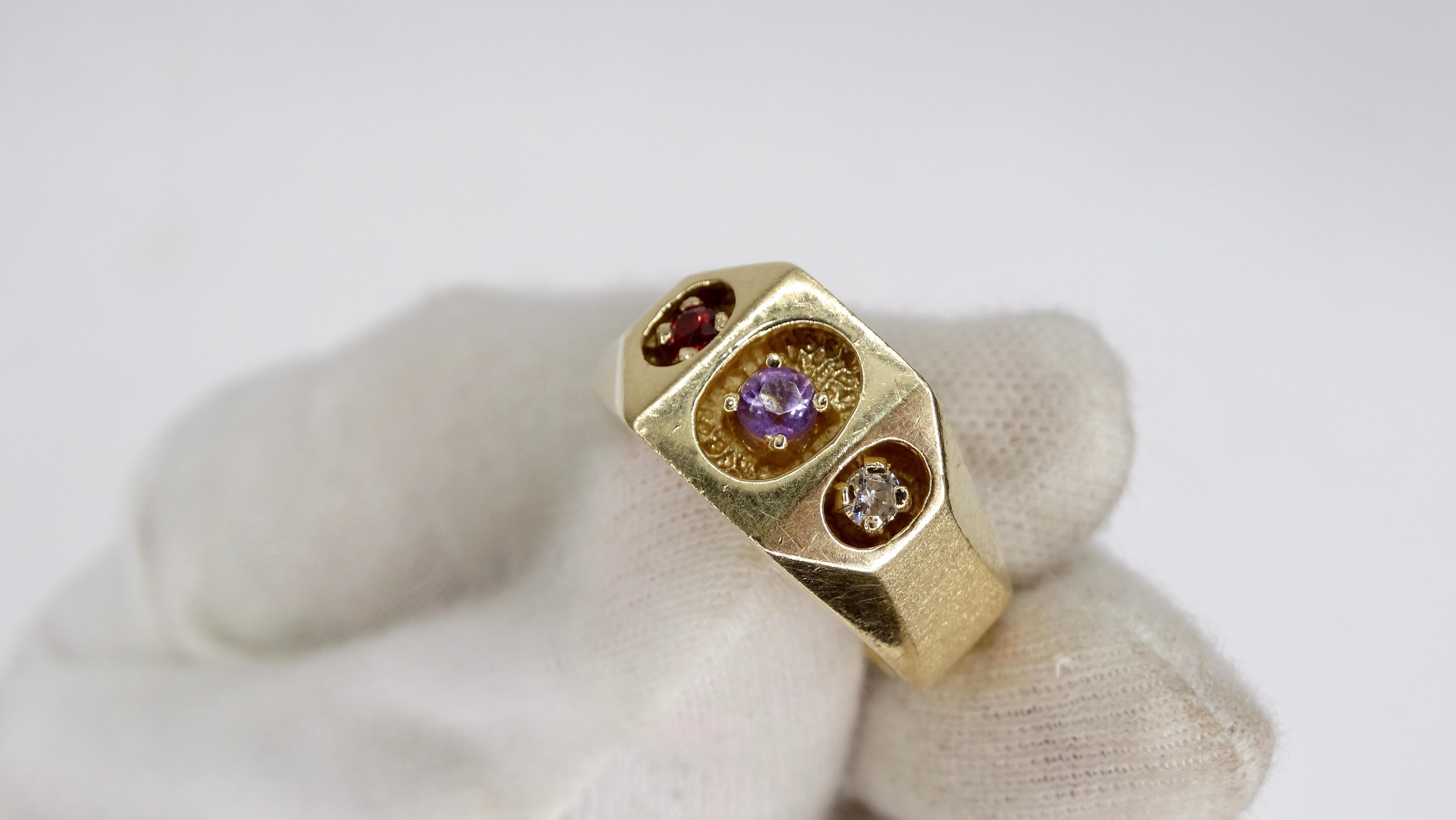 Beautiful 14k Gold ring from the late 20th century featuring a thick band with a round cut Ruby, Amethyst and Diamond in a caved in circular prong setting. Ring is a size 9 and weighs 11.5g total. Perfect to wear for a night out with your favorite