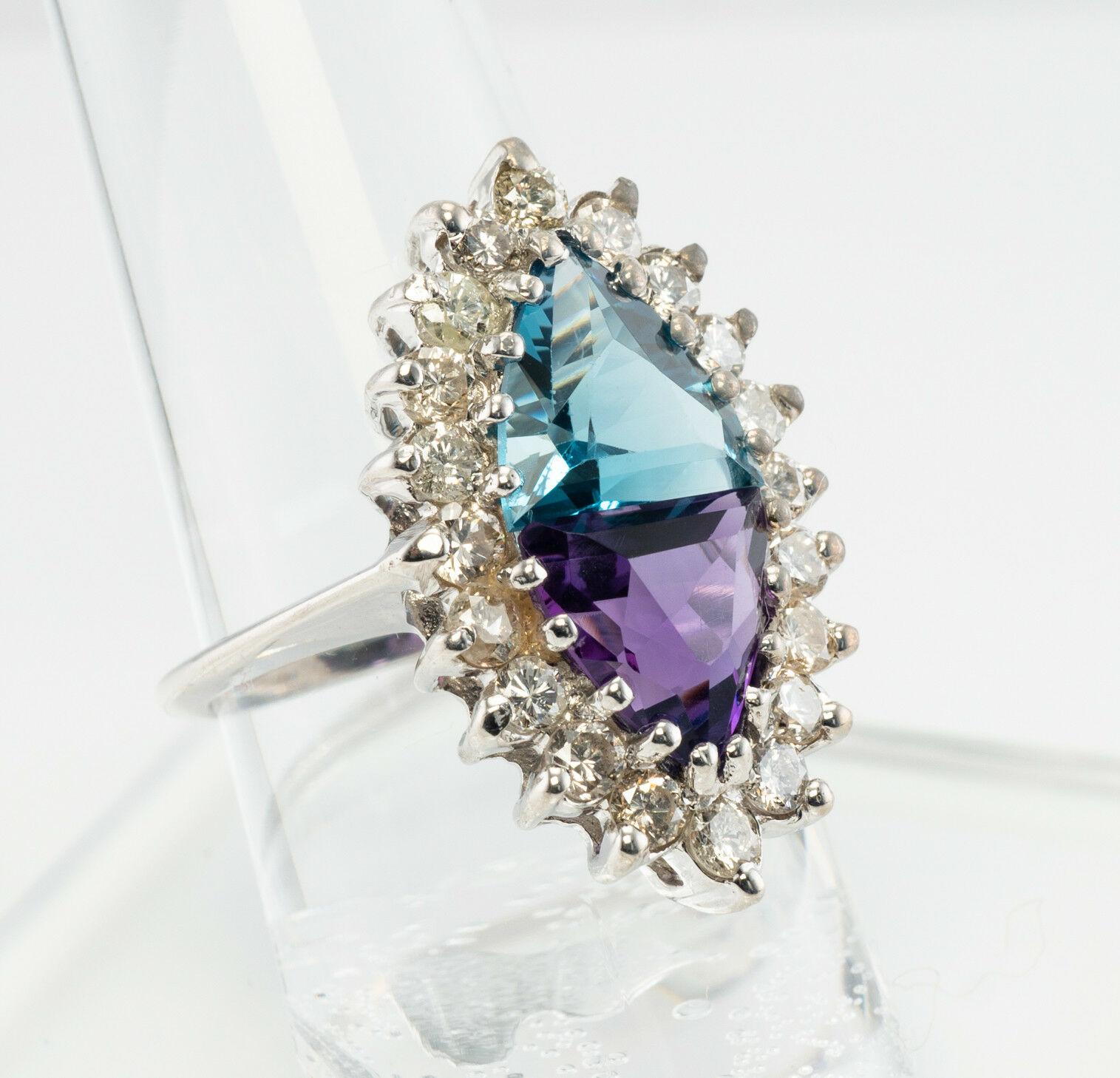 This stunning estate ring is crafted in solid 14K White Gold (carefully tested and guaranteed) and set with trillion cut Topaz and Amethyst, and diamonds. Each genuine Earth mined fancy-cut gemstone measures 8mm x 8mm; they are very clean and