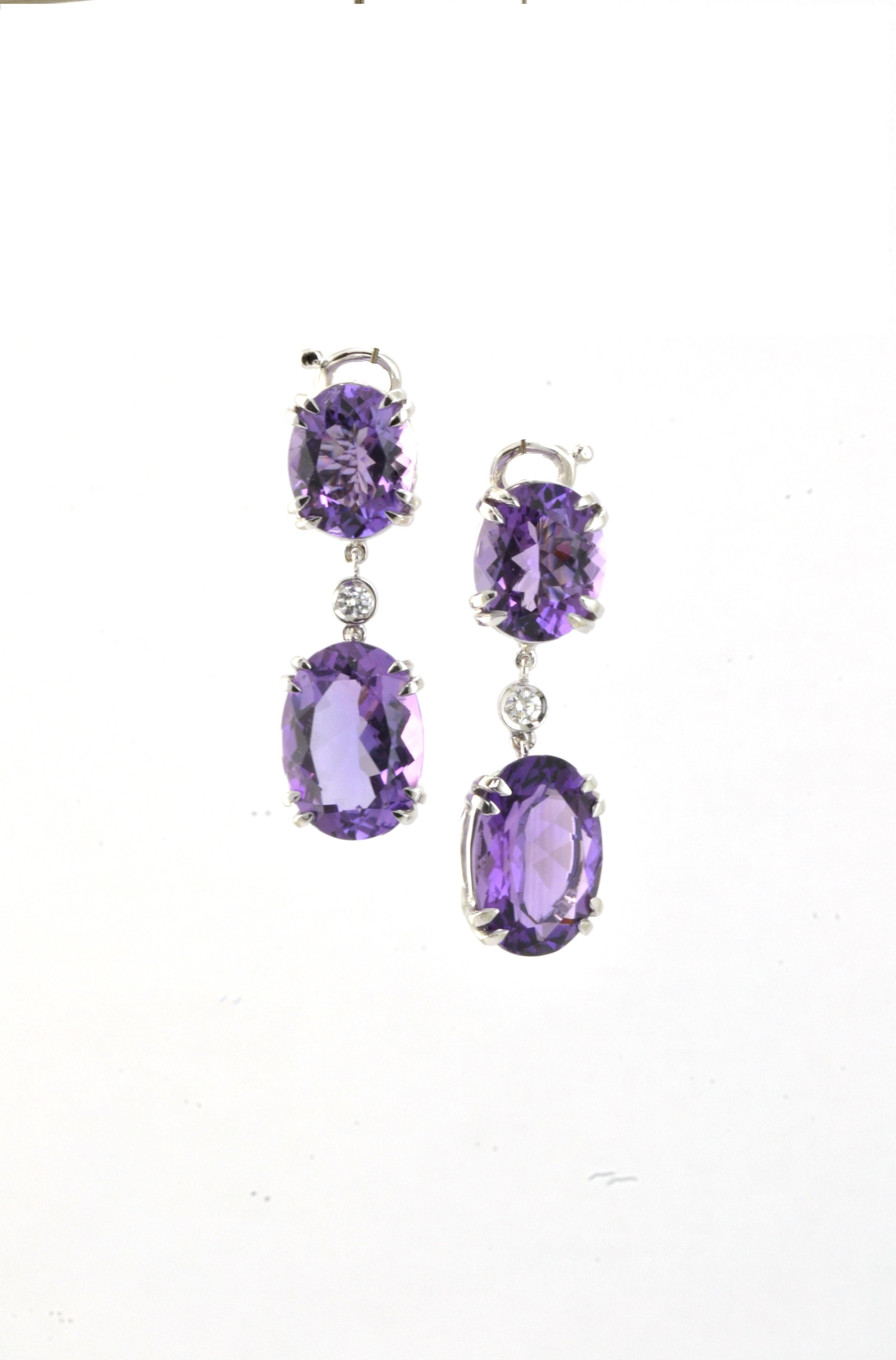 Featuring two oval faceted amethysts, medium vivid purple, having a single diamonds connecting the smaller top amethyst to the bigger pending one. 
Handcrafted in Margherita Burgener family workshop, based in Valenza, Italy. 

18 KT  white gold