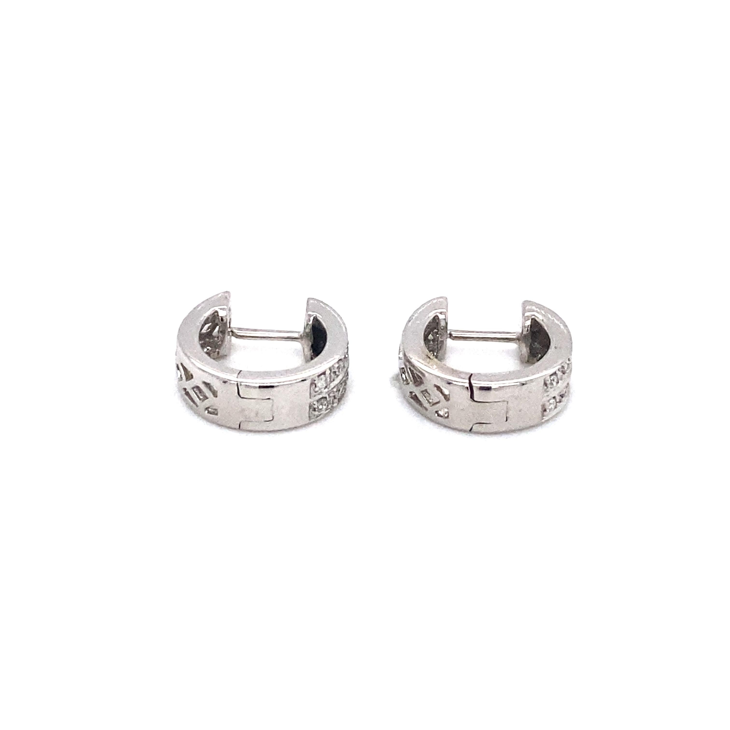 Diamond Huggie Hoops - 14 Karat White Gold, Diamonds

Features:
0.30 carat total Round Brilliant Diamonds
14 Karat White Gold
Open cut out decorative backs
Hinged Snap Back Posts
Earrings measure 11.5 millimeters long x 4.5 millimeters wide

Earring
