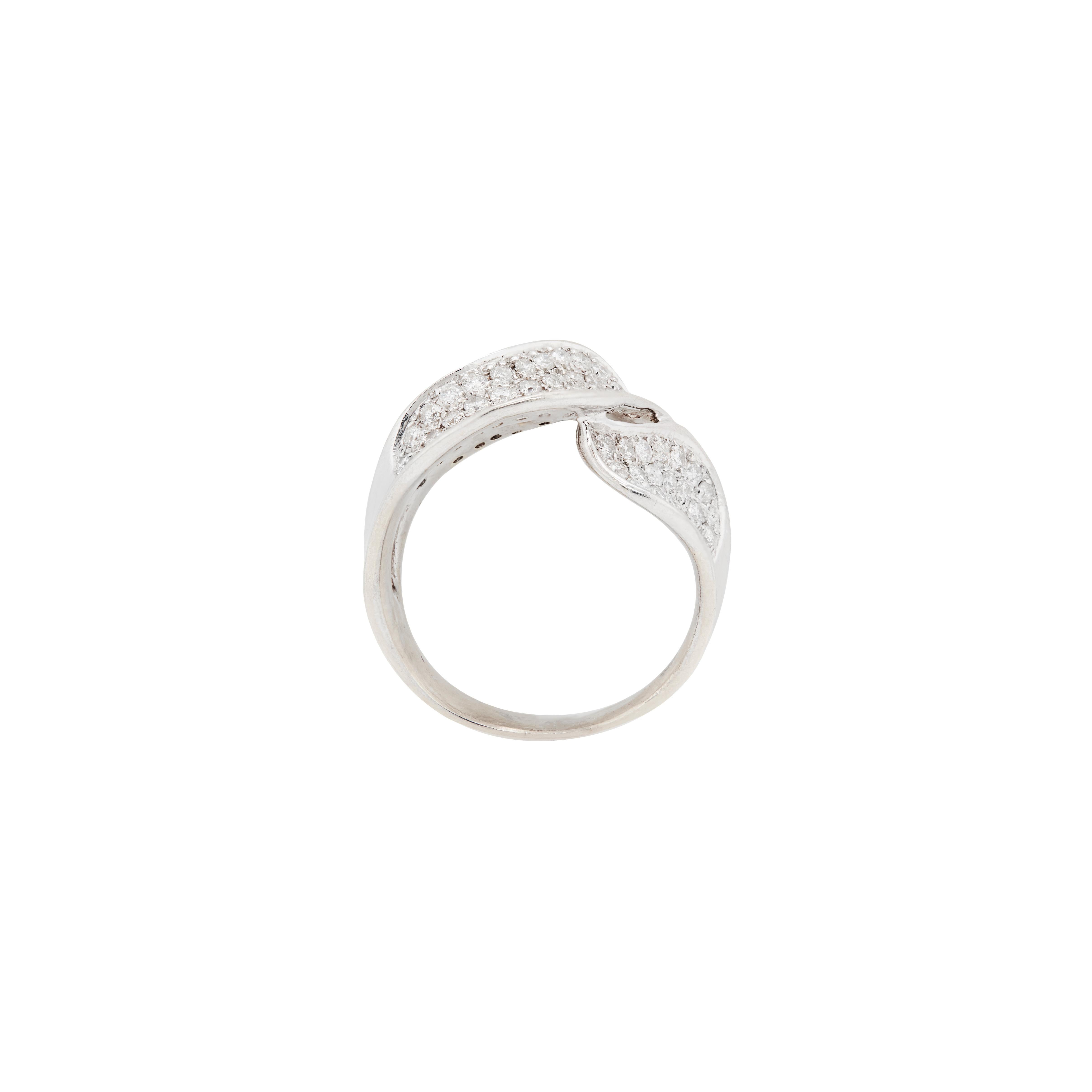 Make a statement with this stunning cluster dress ring, masterfully crafted in cool 18 carat white gold. 

This piece features an elegant wave design with a fluid, sculptural look, pavé set with approximately 2.00ct of fine quality round brilliant